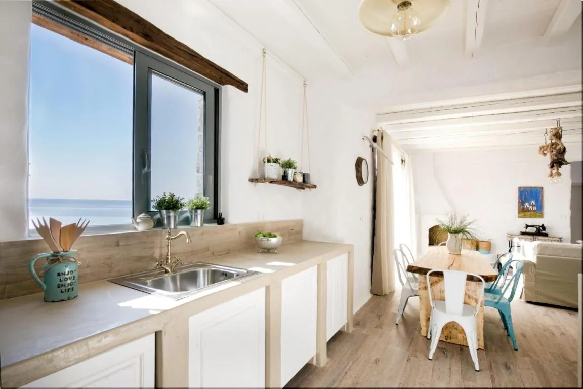 Kitchen or kitchenette in Axiotheaton Villas