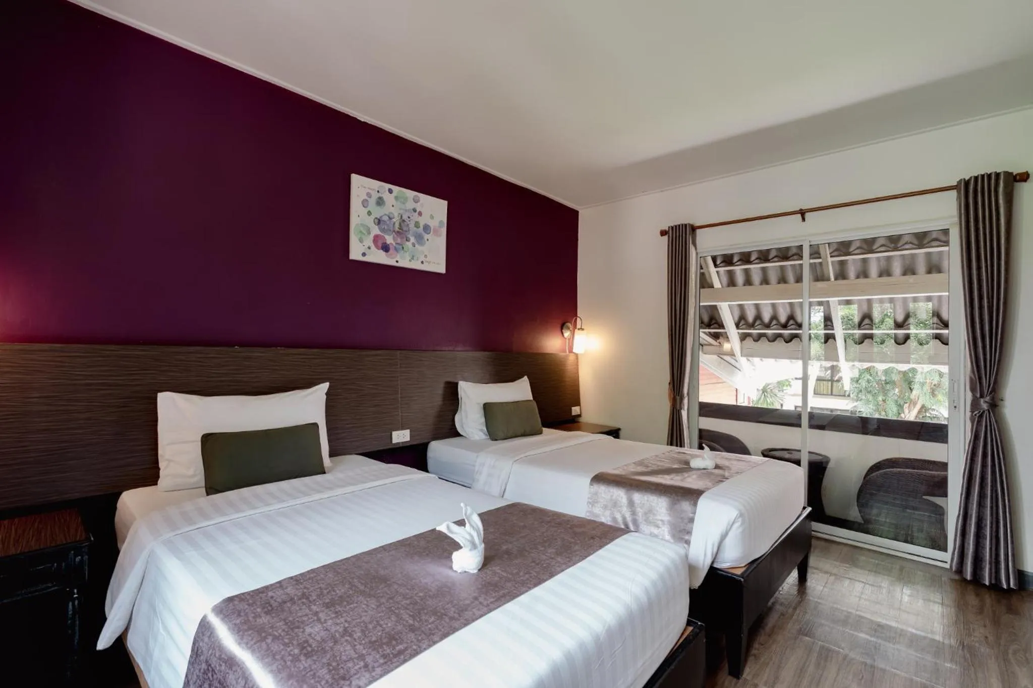 Bed in Natural Park Resort Pattaya