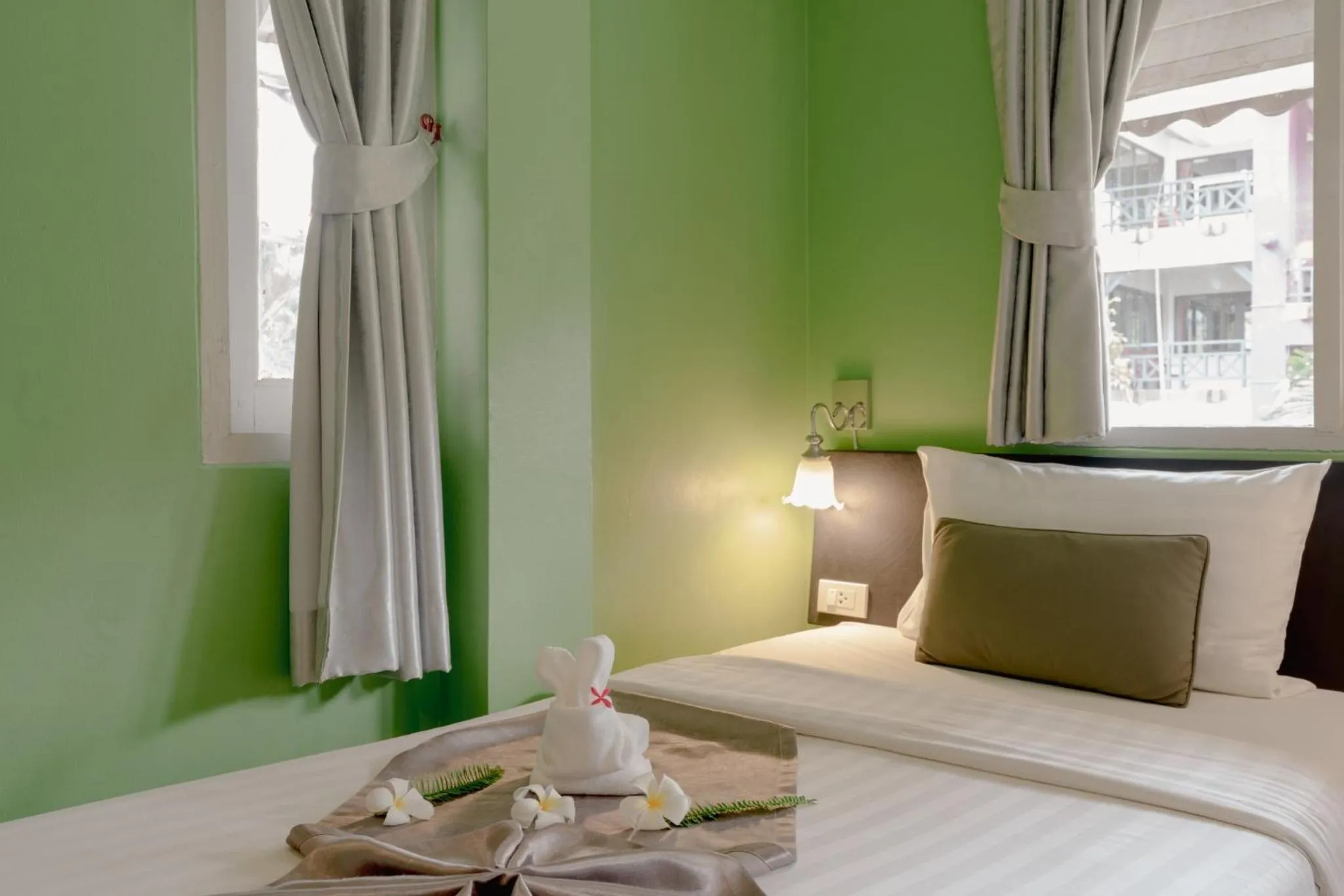 Bed in Natural Park Resort Pattaya