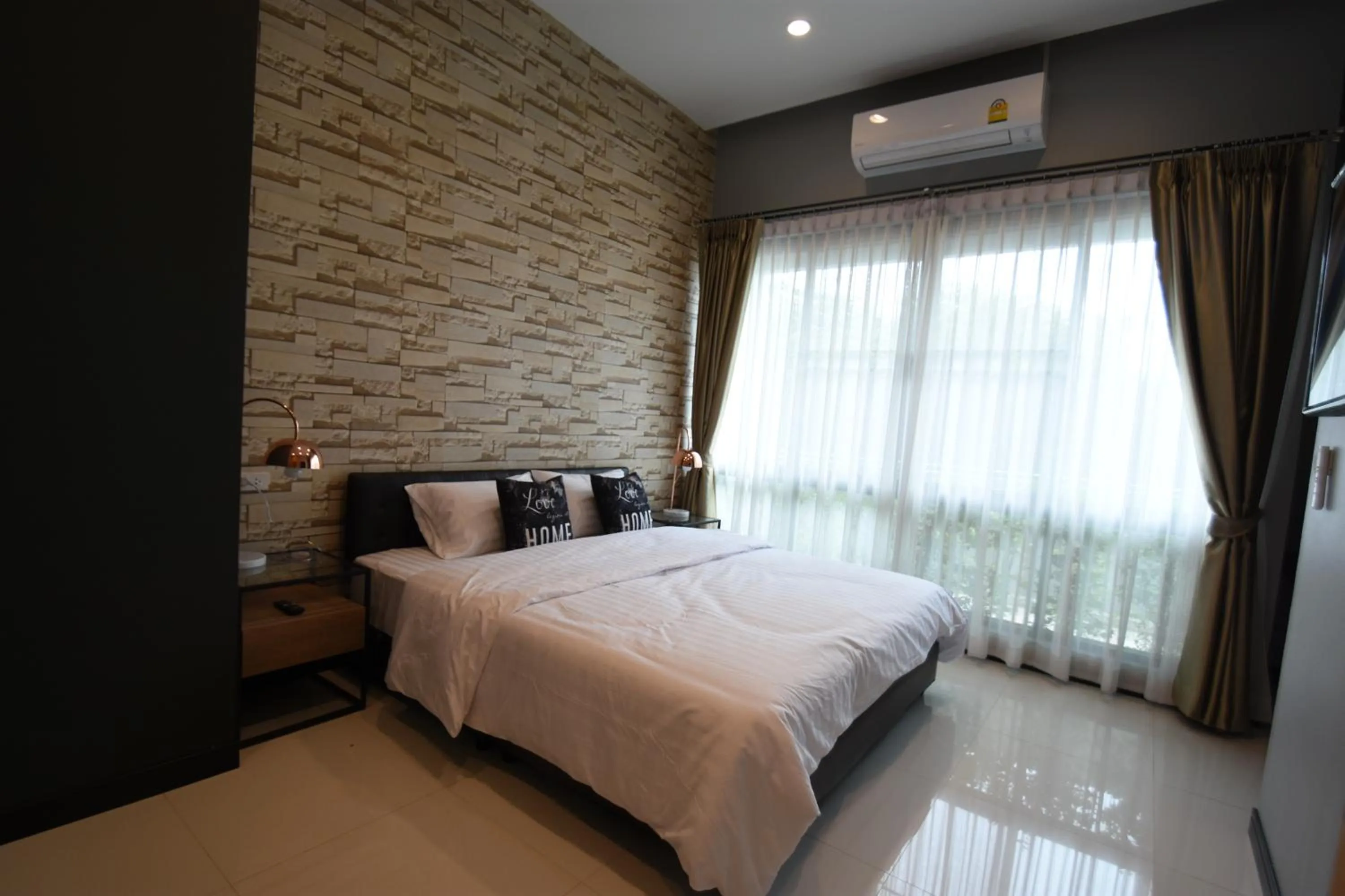Bed in Natural Park Resort Pattaya