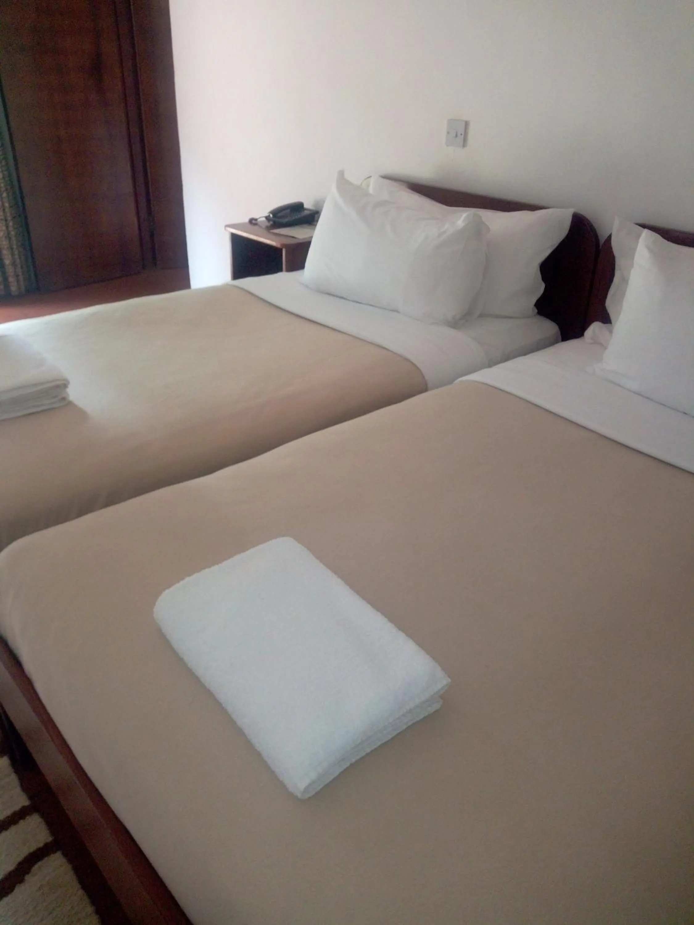 Bed in Chaminuka Lodge