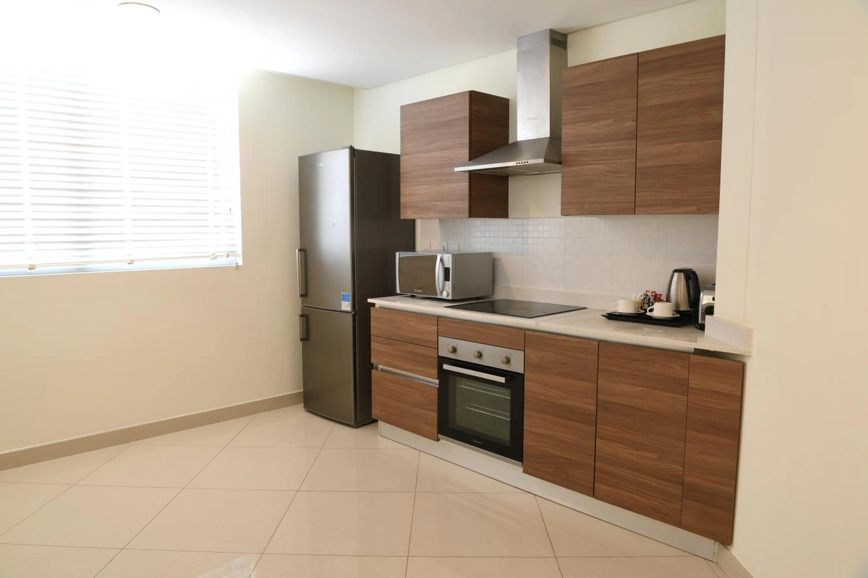 Kitchen or kitchenette in Gulf Suites Hotel Amwaj