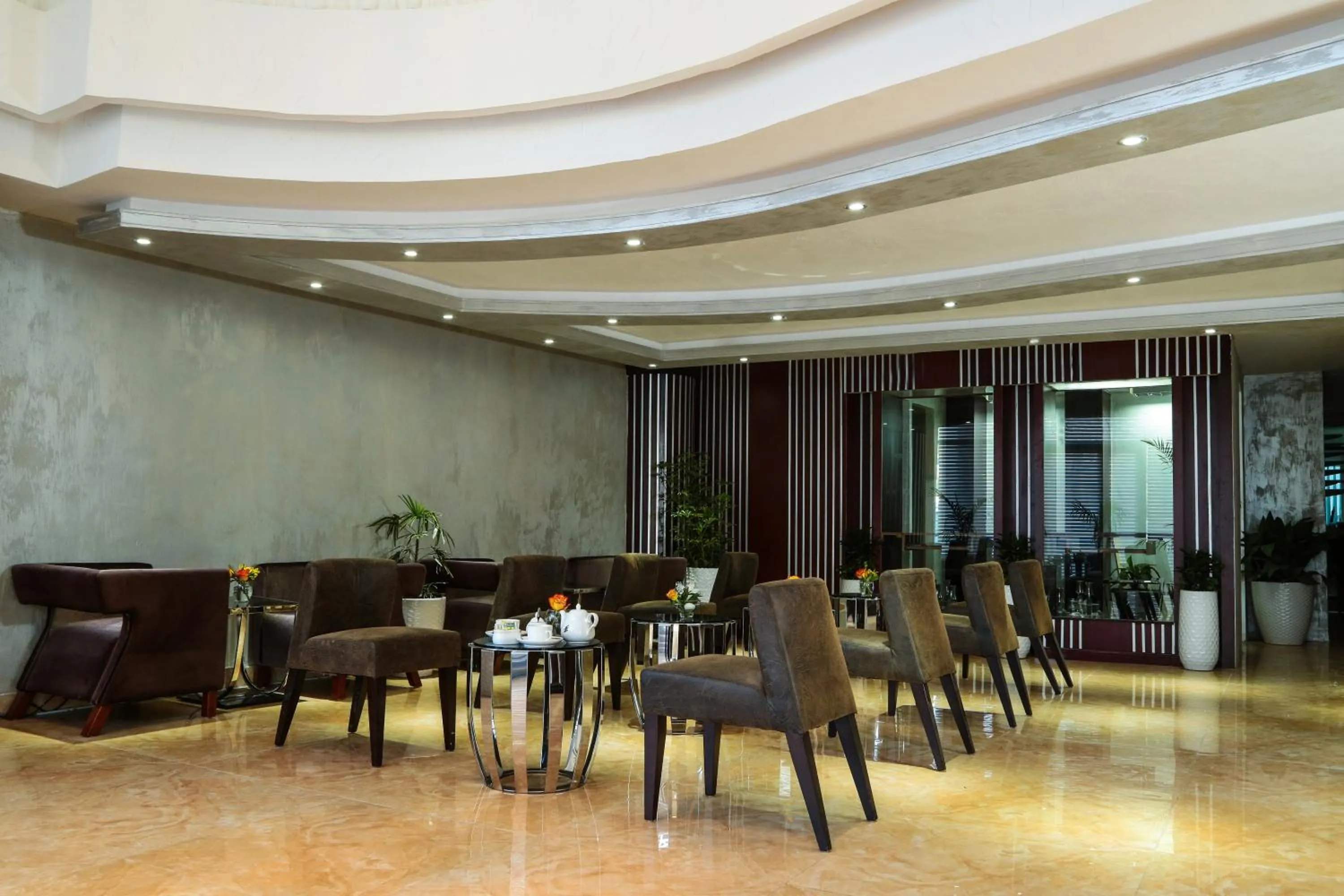 Communal lounge/ TV room in Grand Eliana Hotel Conference & Spa