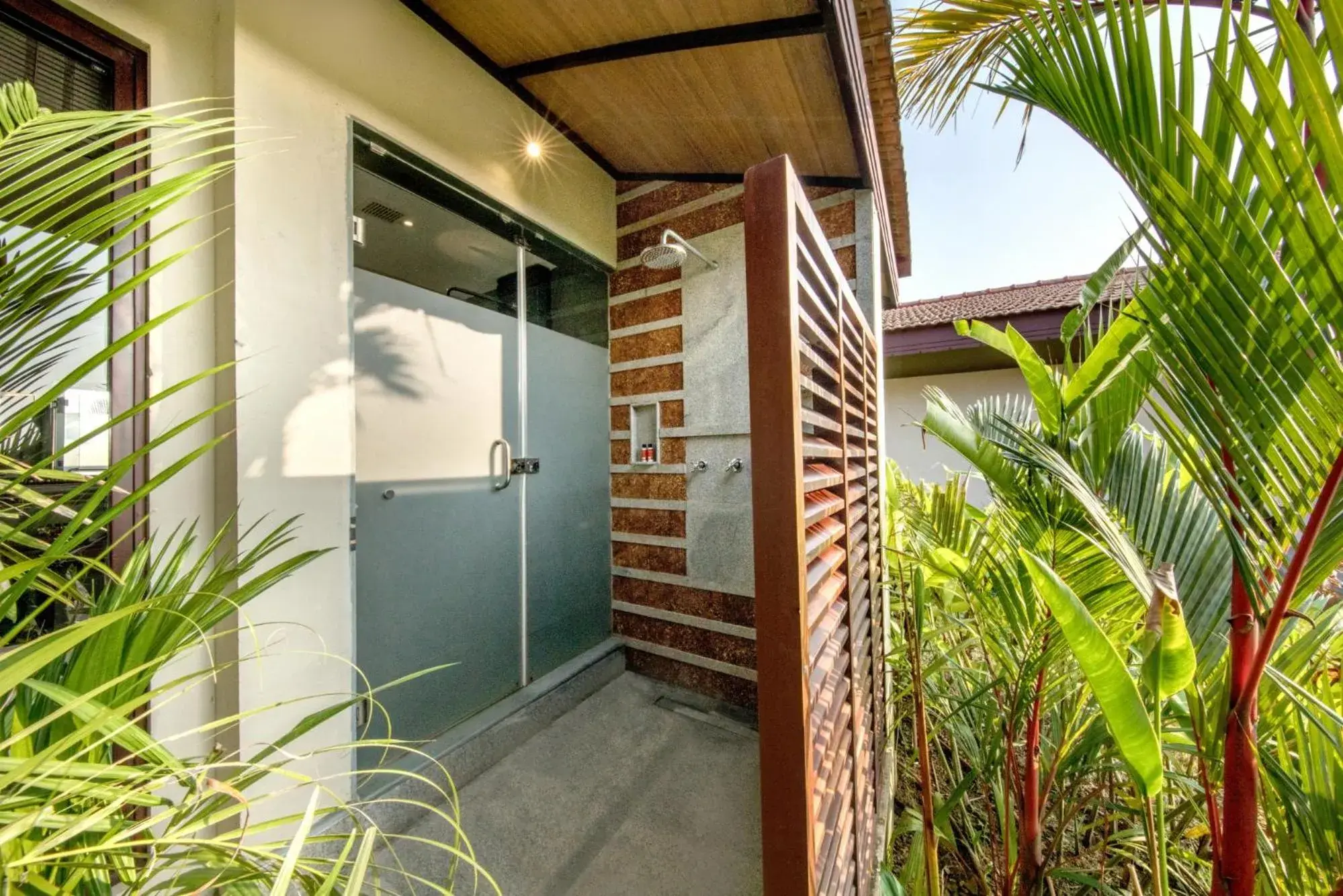 Bathroom in Niraamaya Wellness Retreats Backwaters And Beyond Kumarakom Bathroom in Niraamaya Wellness Retreats Backwaters And Beyond Kumarakom