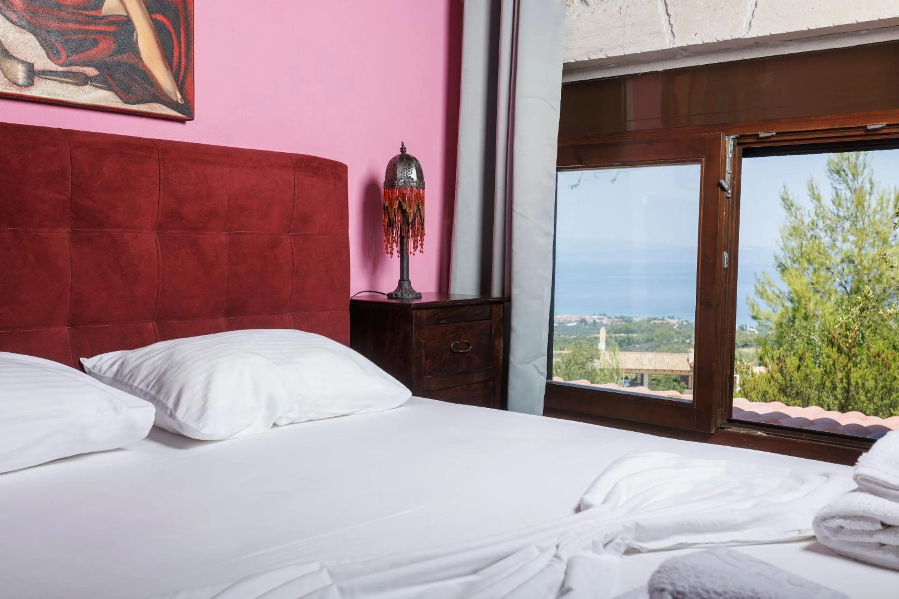 Bed in Akritas Ef Zin Villas & Suites