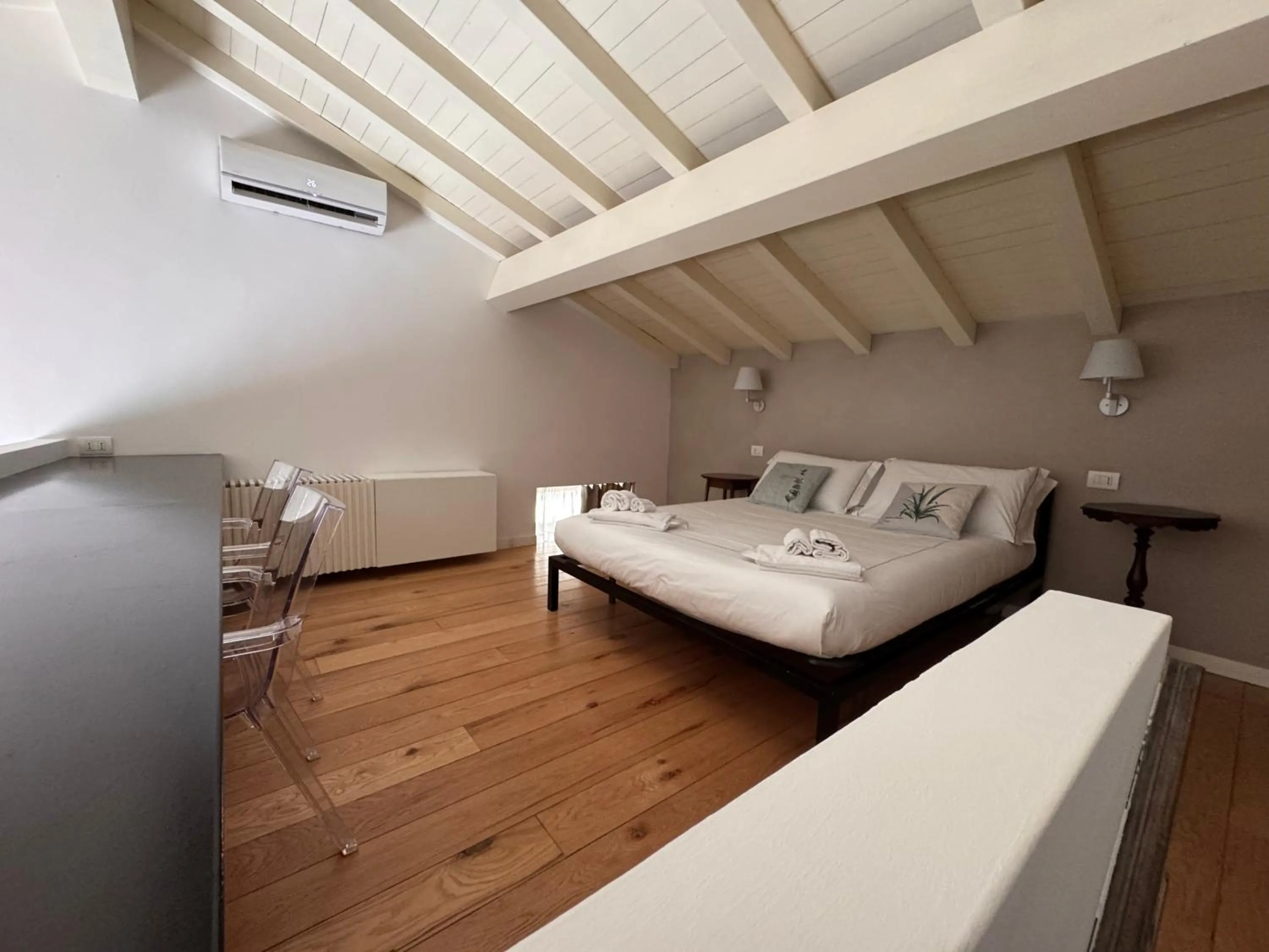 Bed in Talè Restaurant & Suite