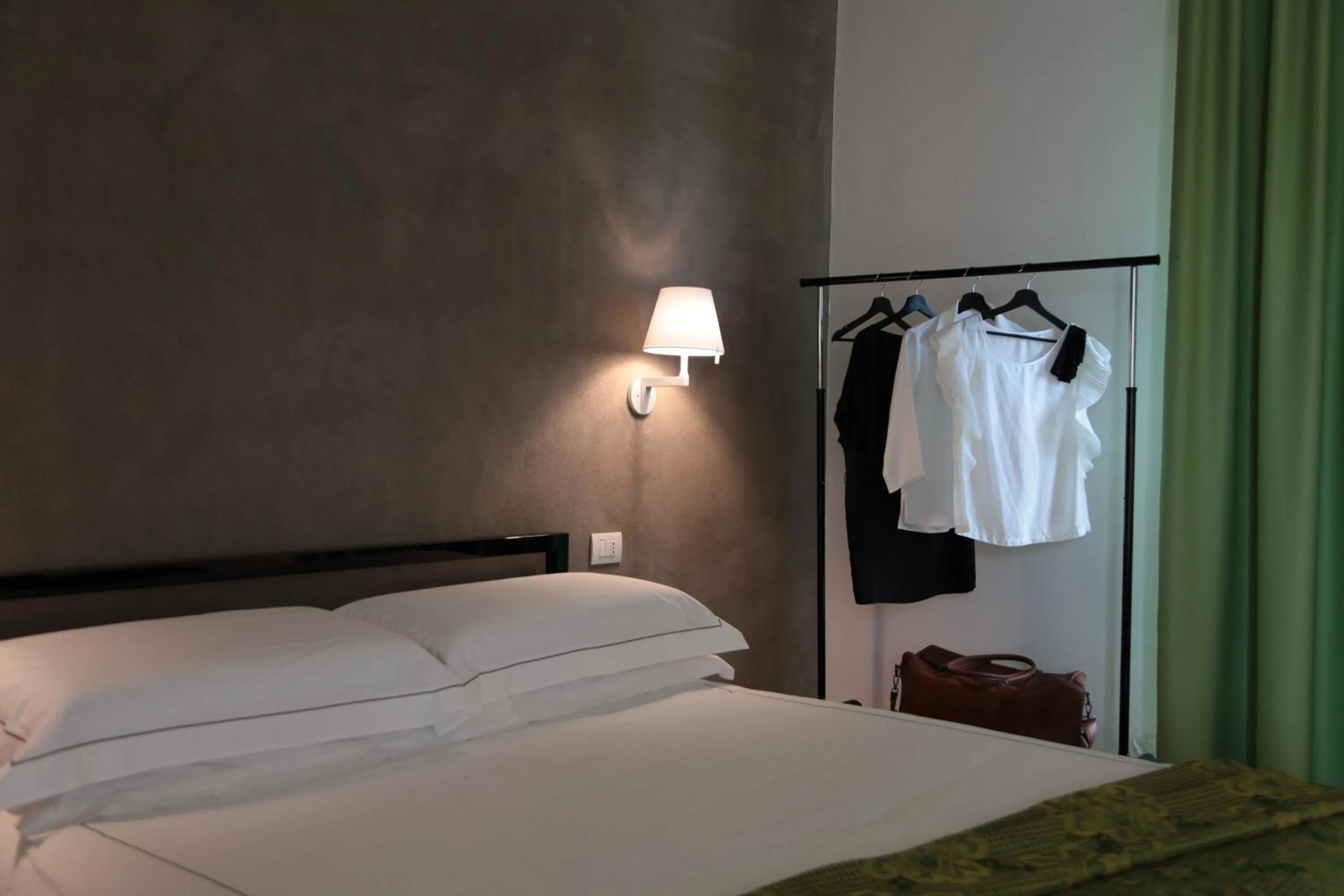 Bed in Talè Restaurant & Suite