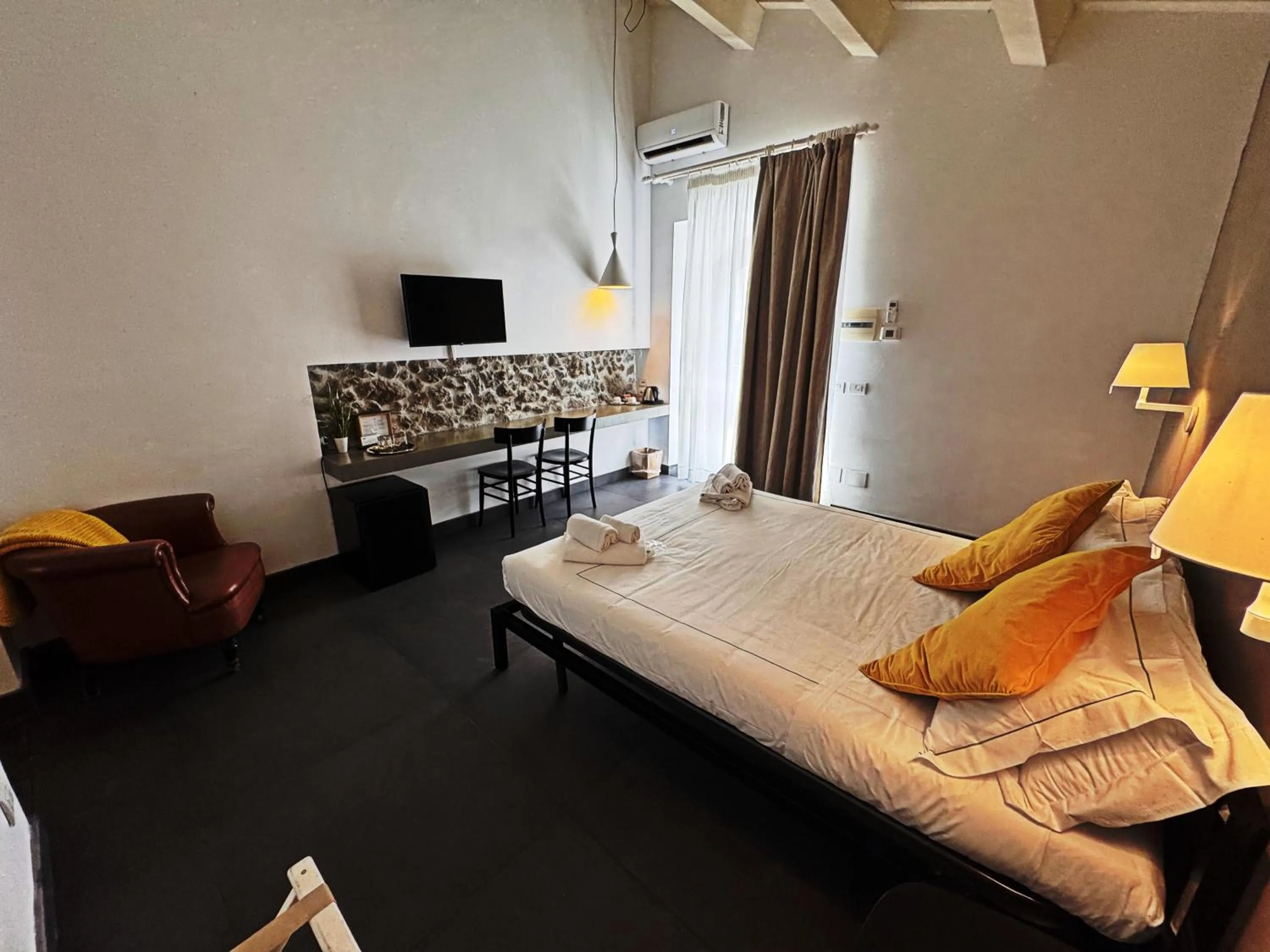 Bed in Talè Restaurant & Suite