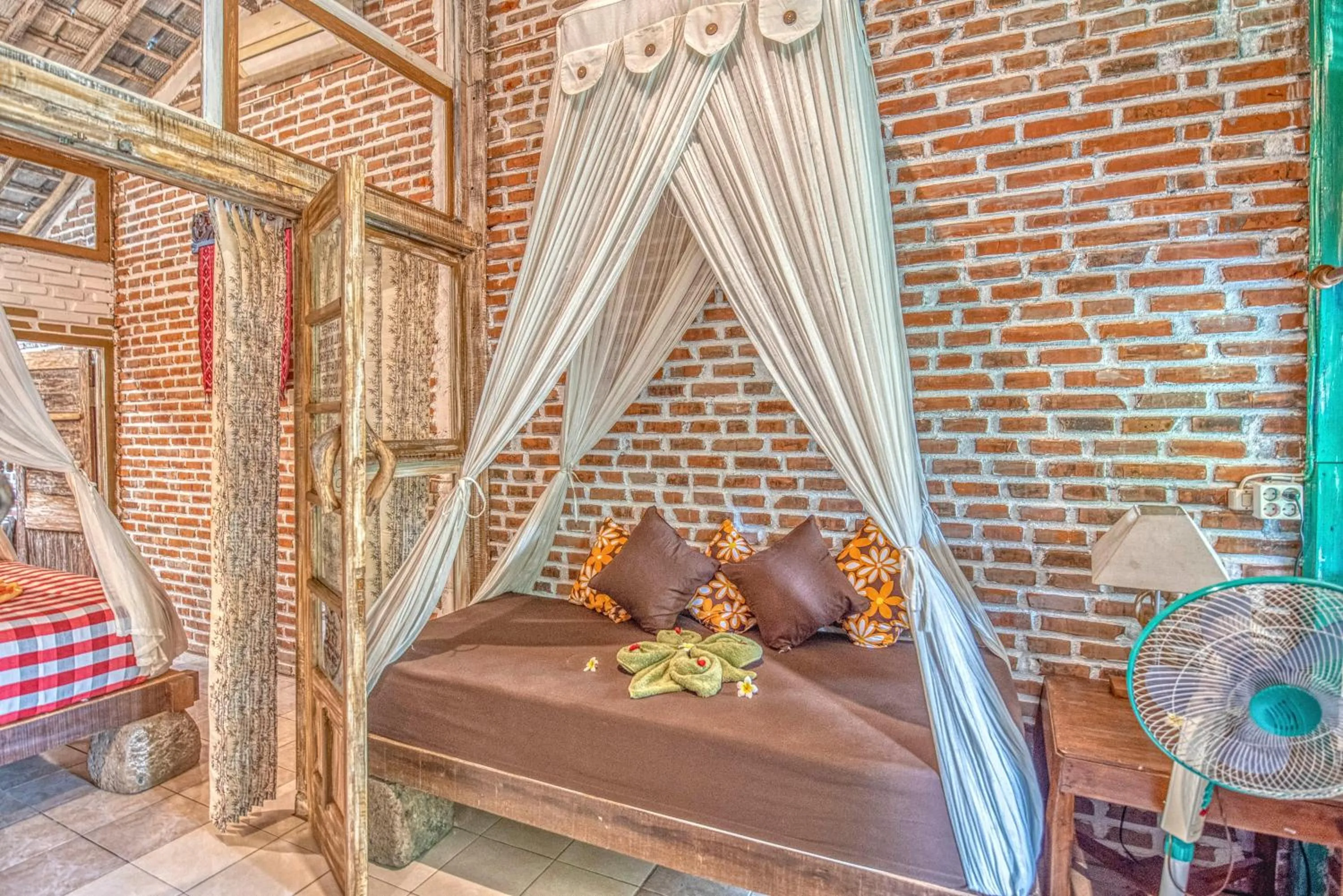 Bed in Santhiku Hotel & SPA