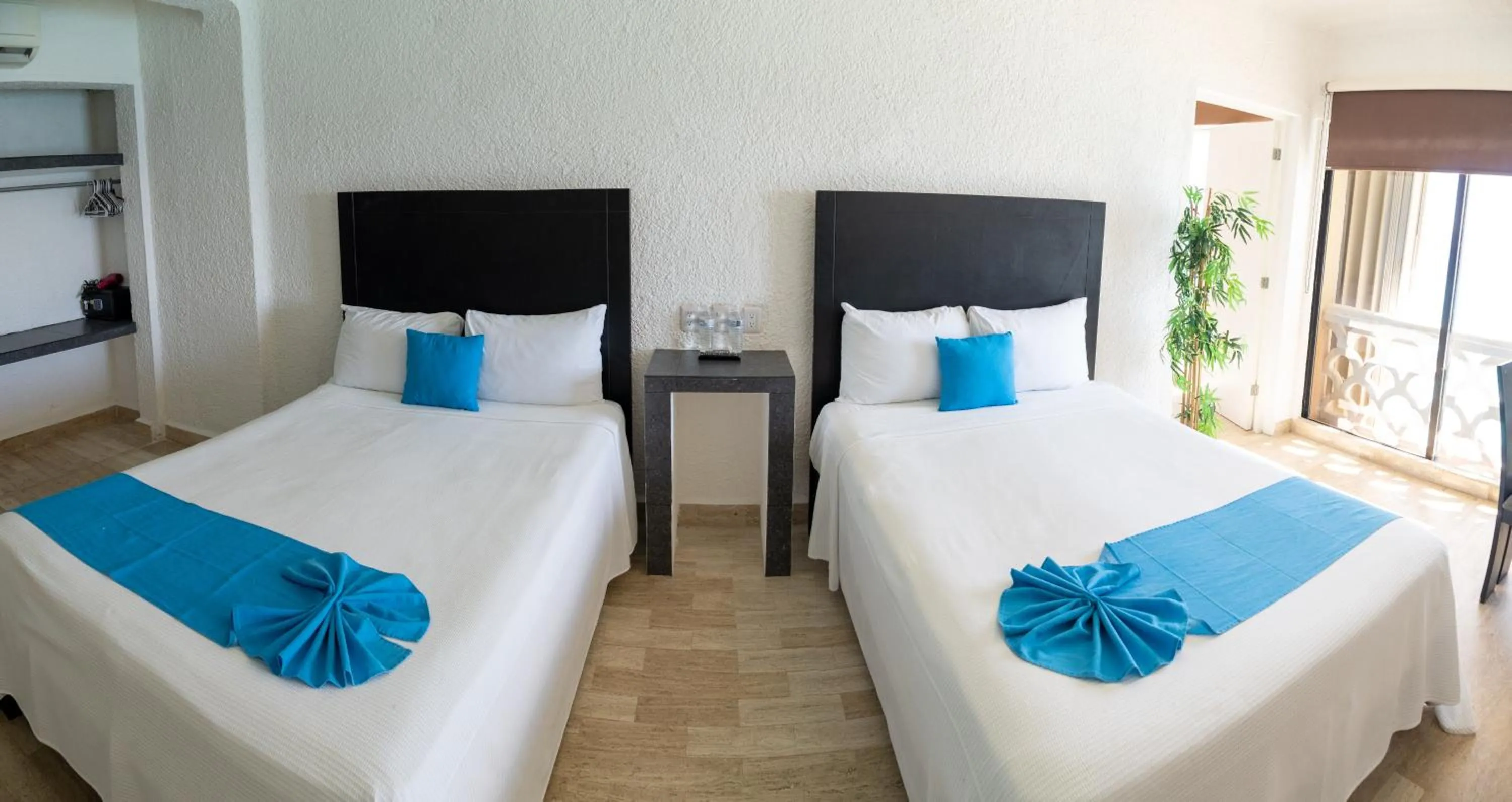 Bed in Cancún Plaza Sea View