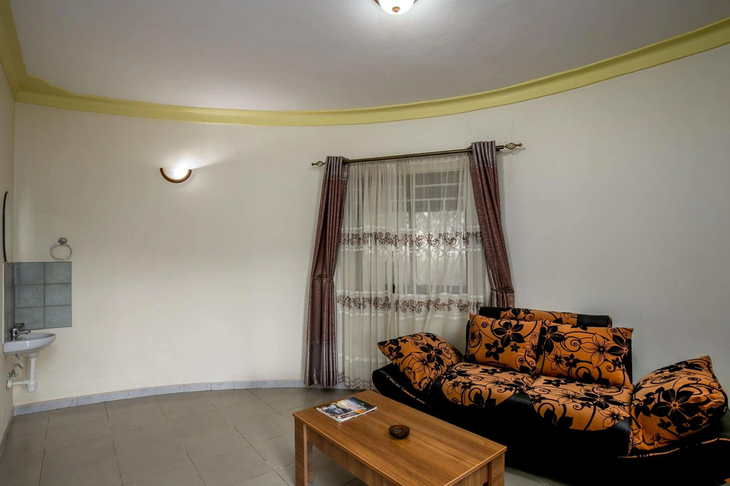 Living room in The Crested Crane Bwindi Hotel