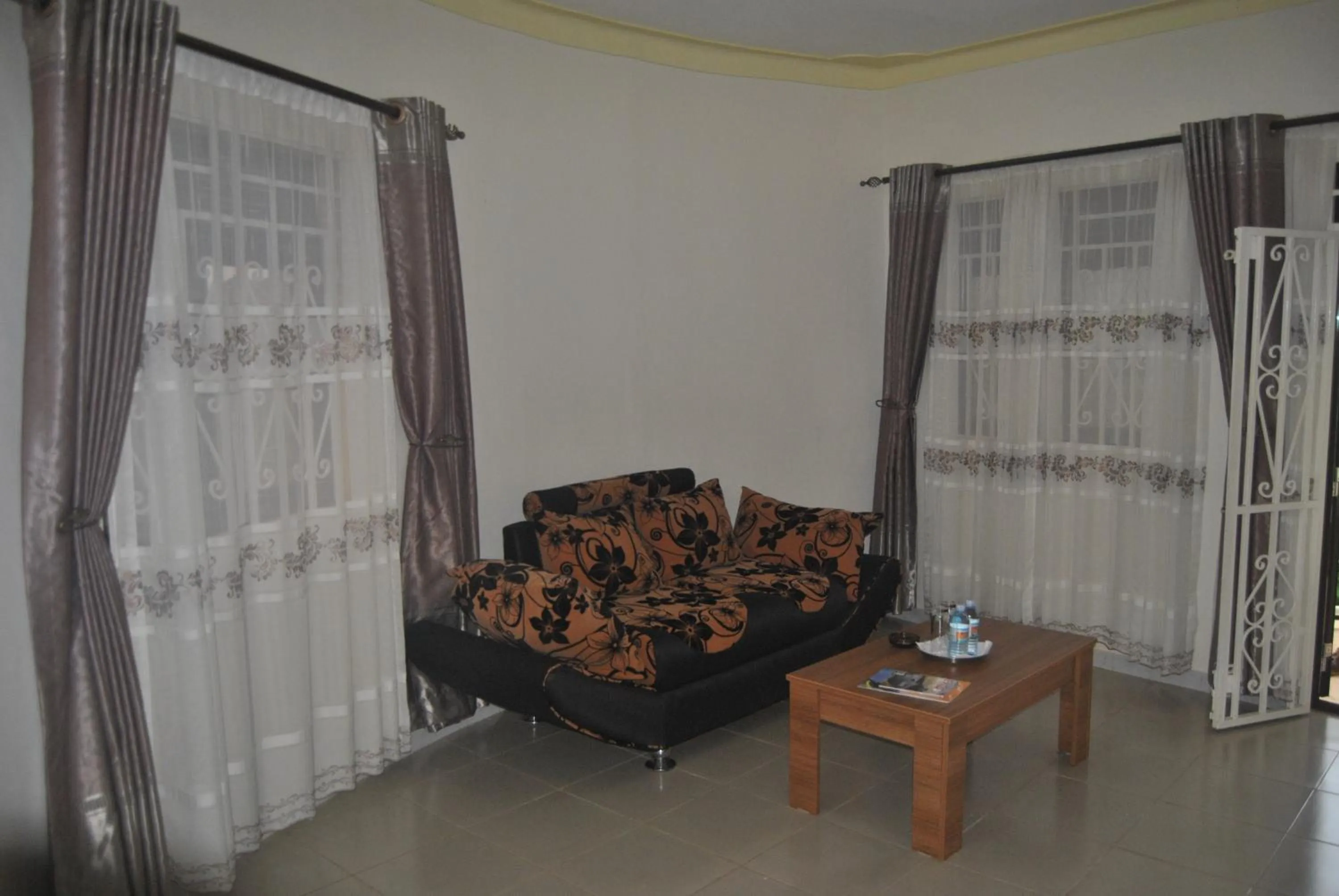 Living room in The Crested Crane Bwindi Hotel