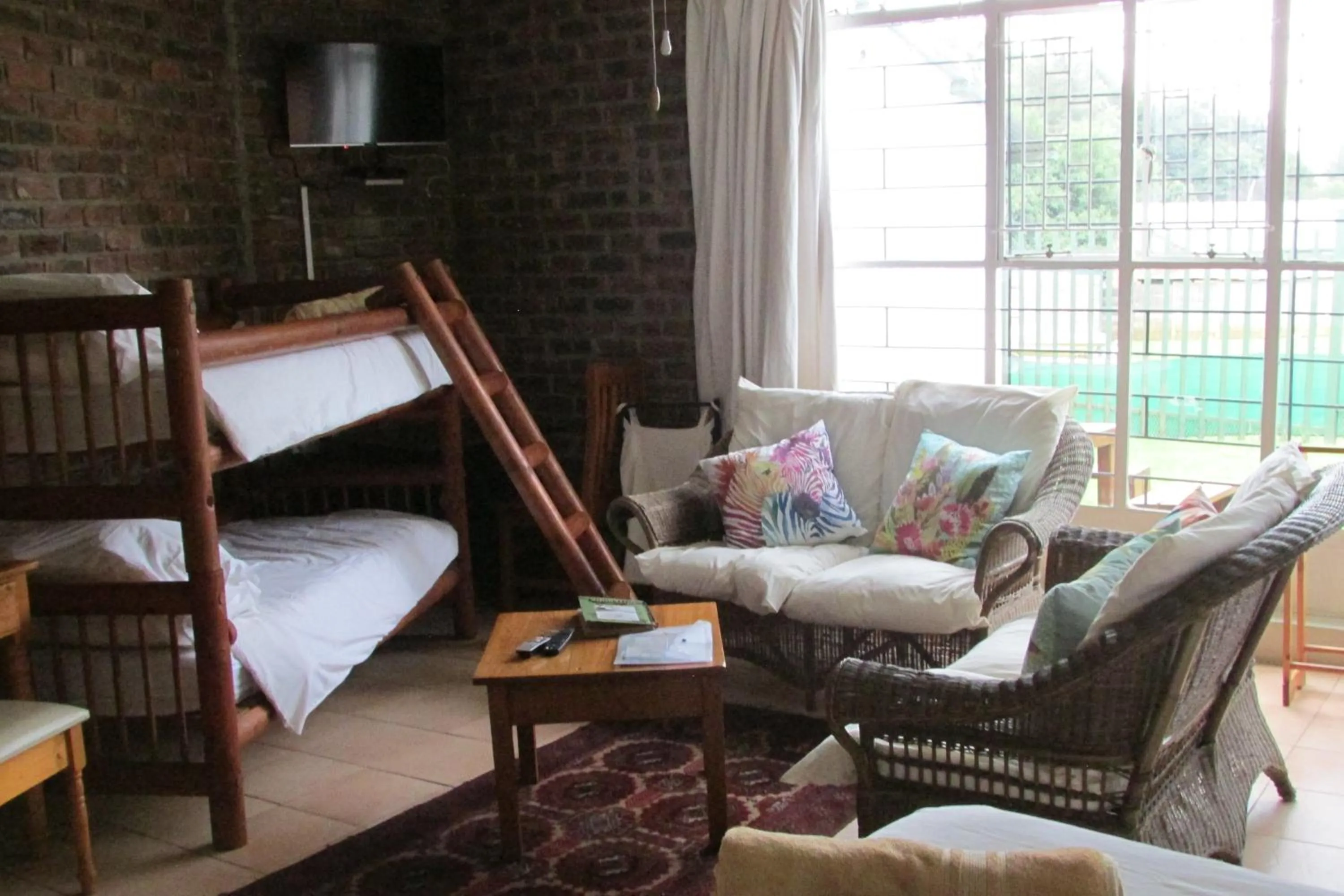 Living room, Bed in Absolute Leisure Cottages