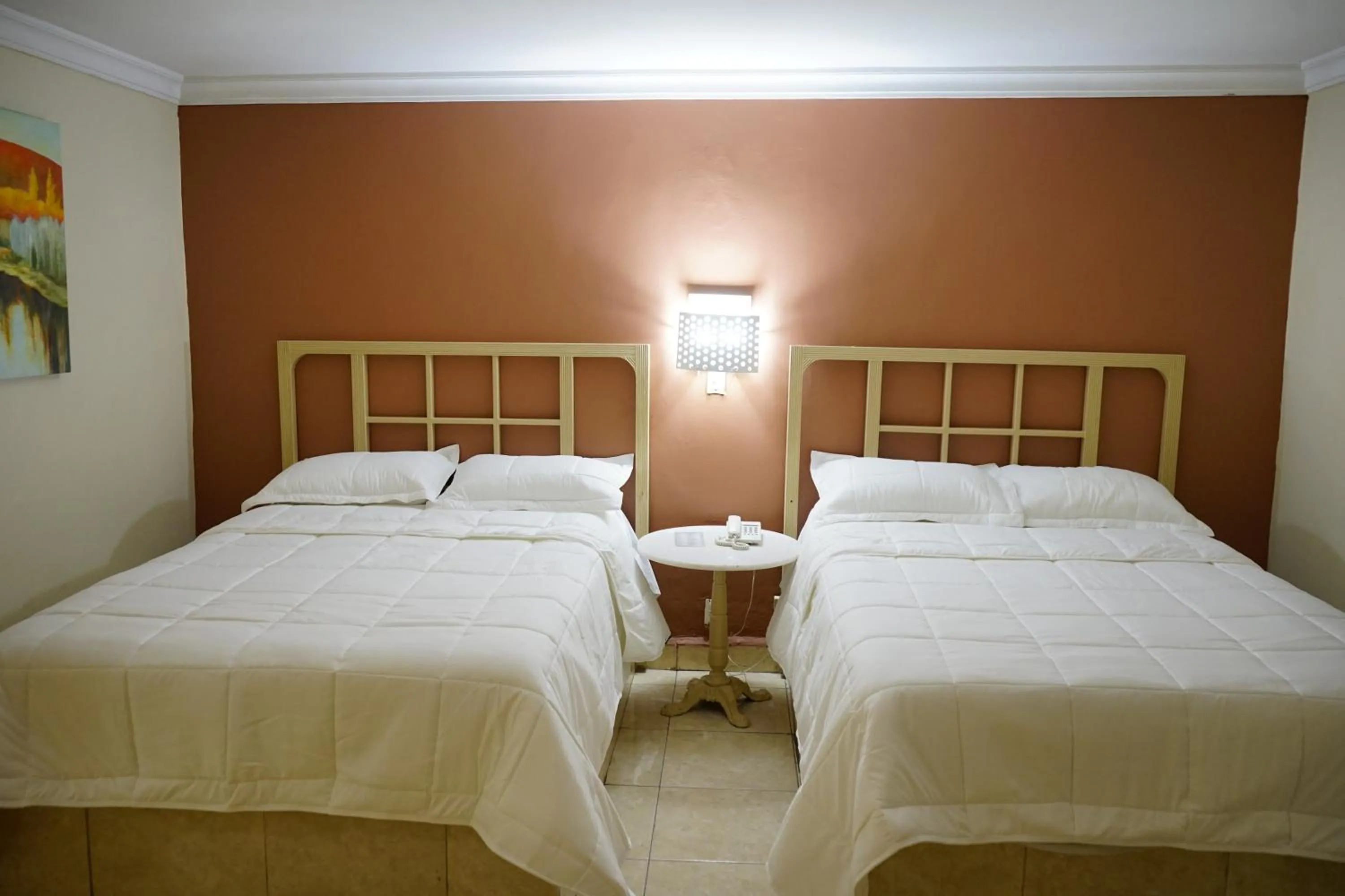 Bed in Hotel Posada del Sol Inn