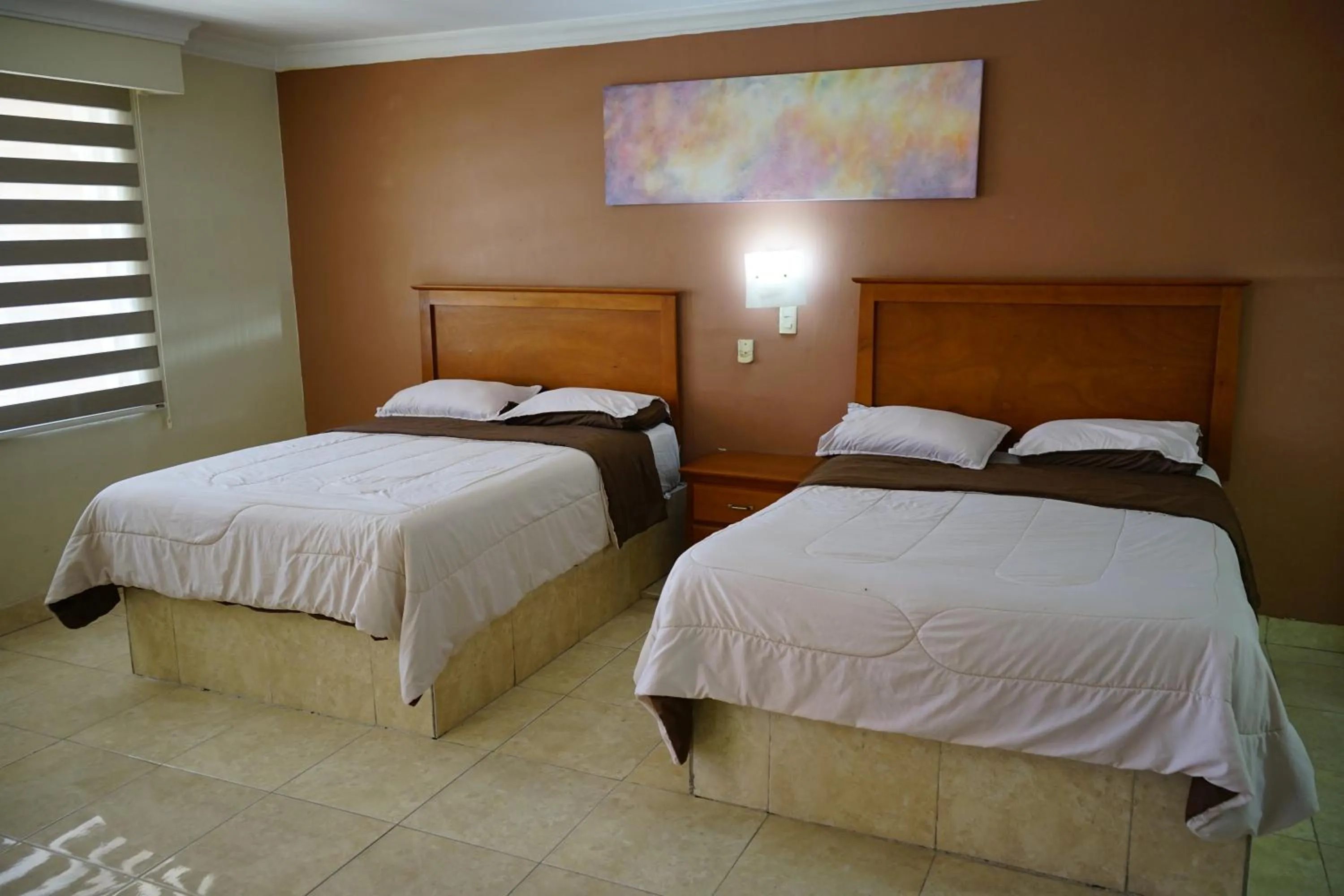 Bed in Hotel Posada del Sol Inn