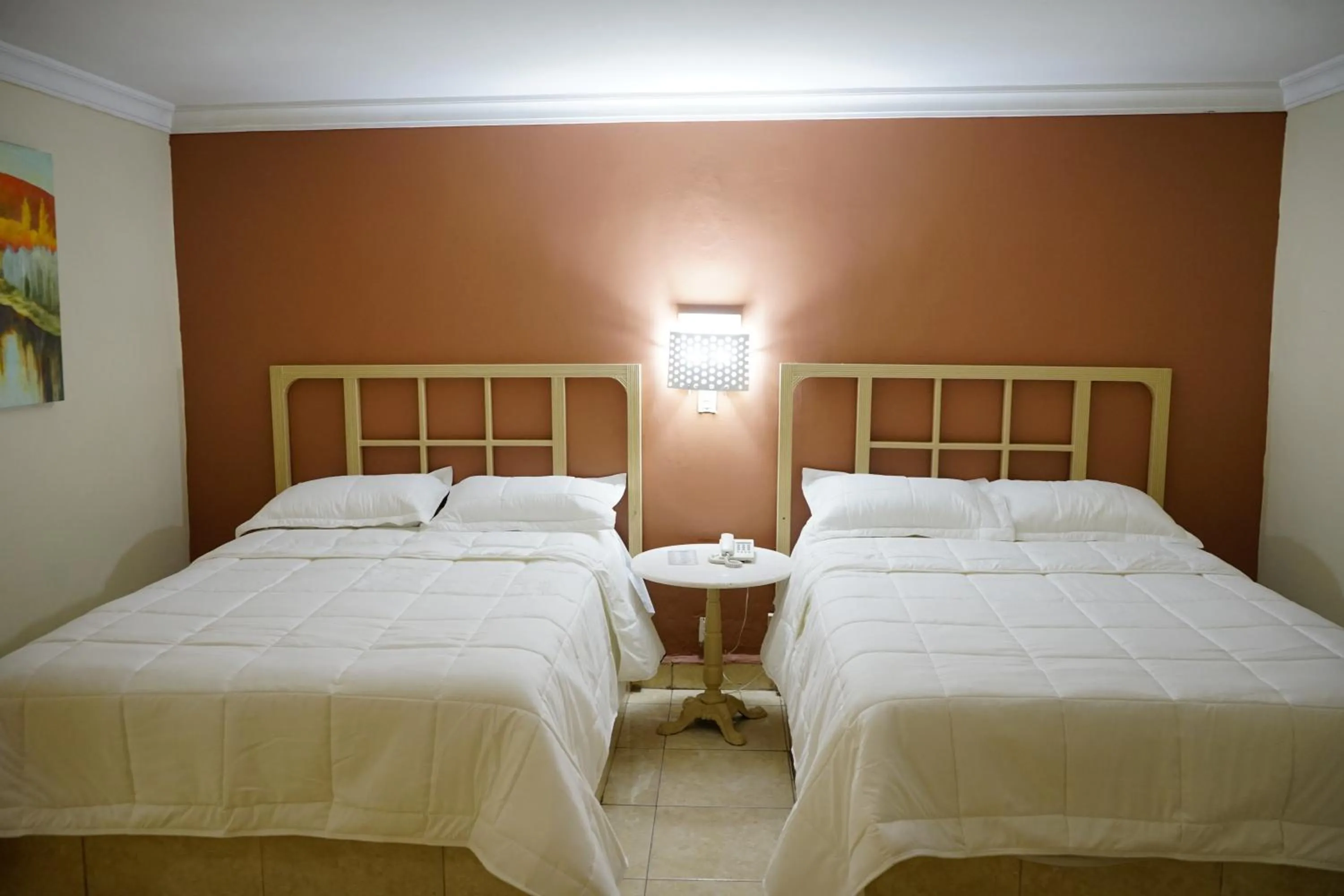 Bed in Hotel Posada del Sol Inn