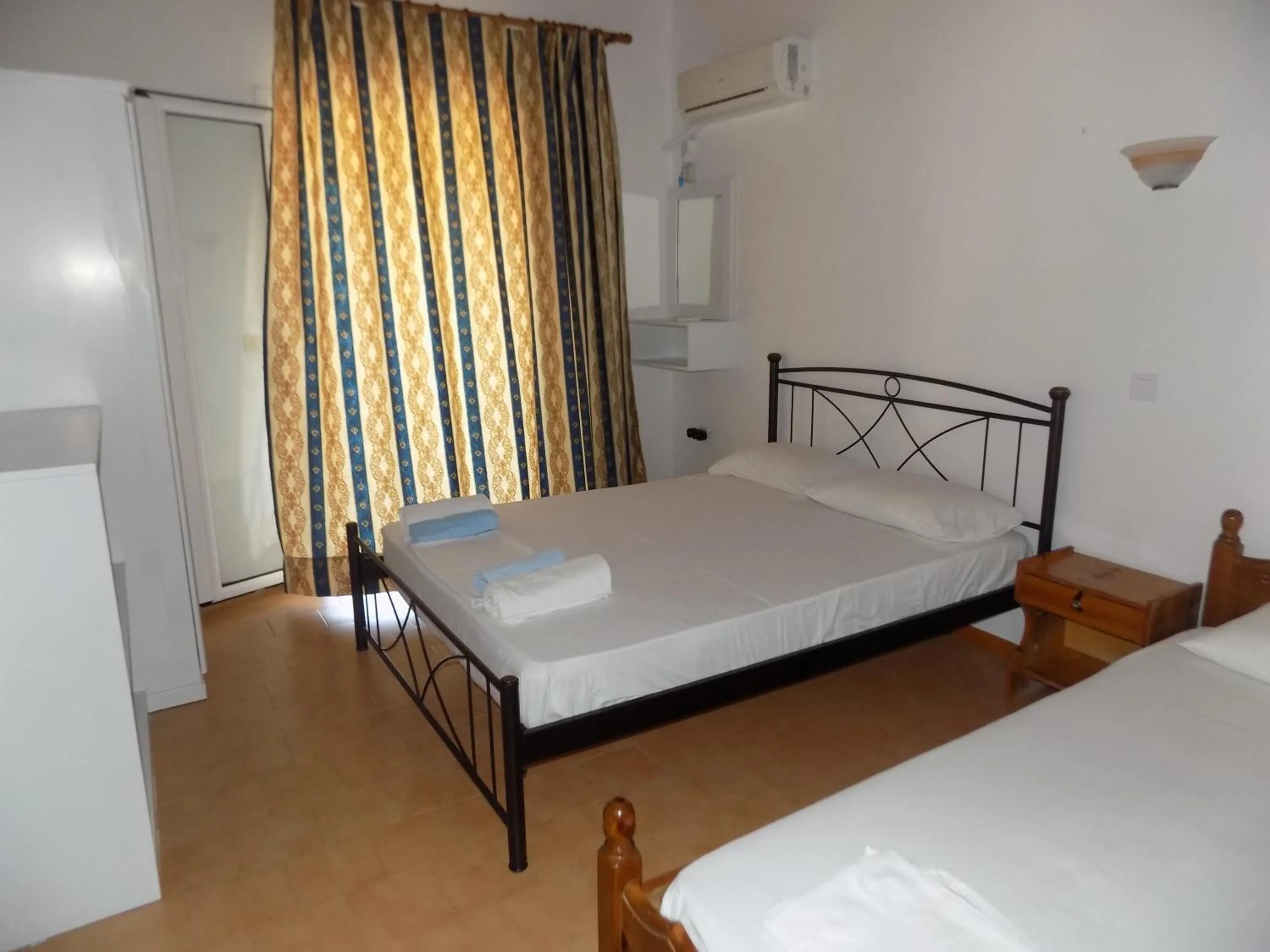 Bed in Apartments Elli - Nikos