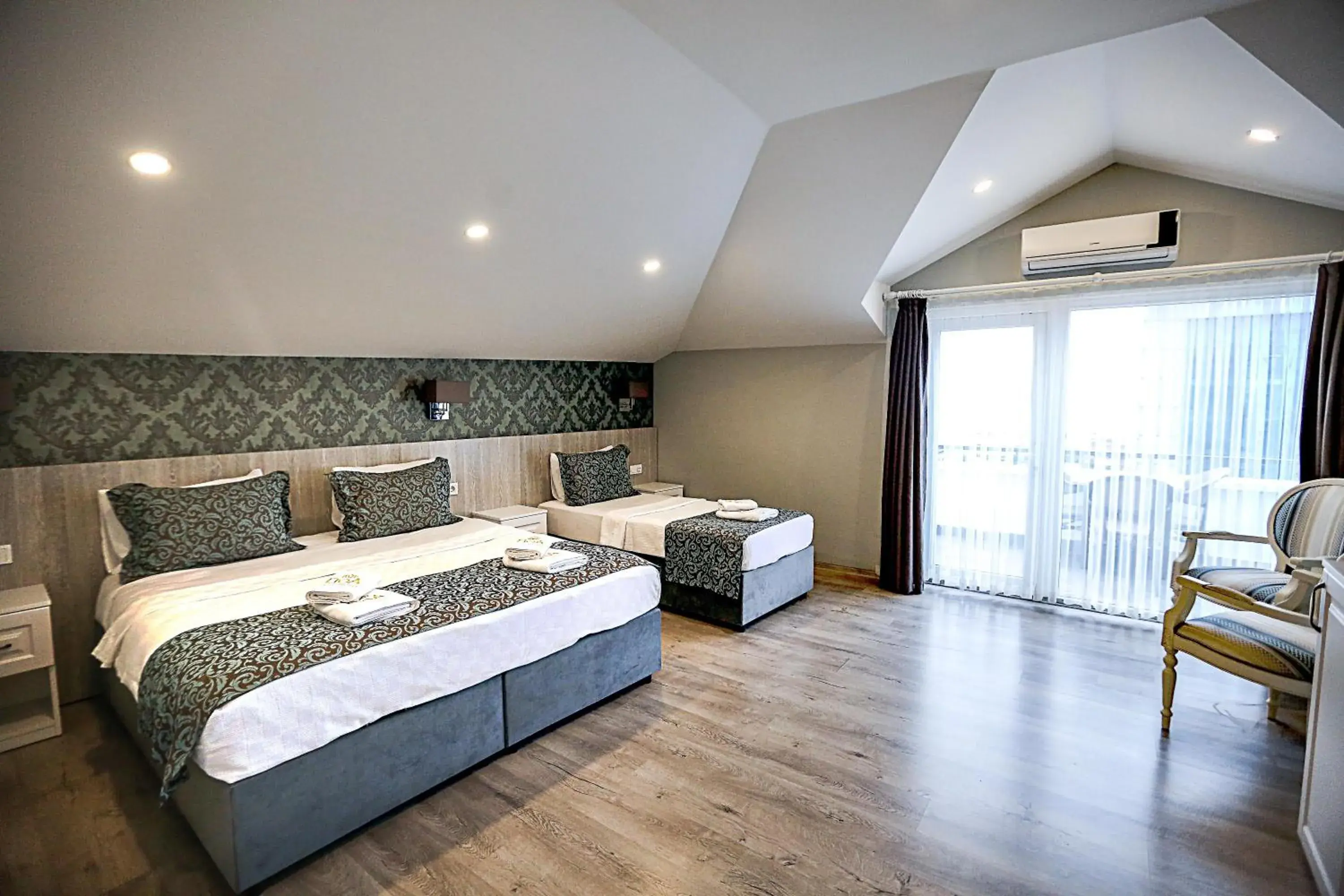 Triple Room with Sea View and Balcony in Doa Suite Hotel Triple Room with Sea View and Balcony in Doa Suite Hotel