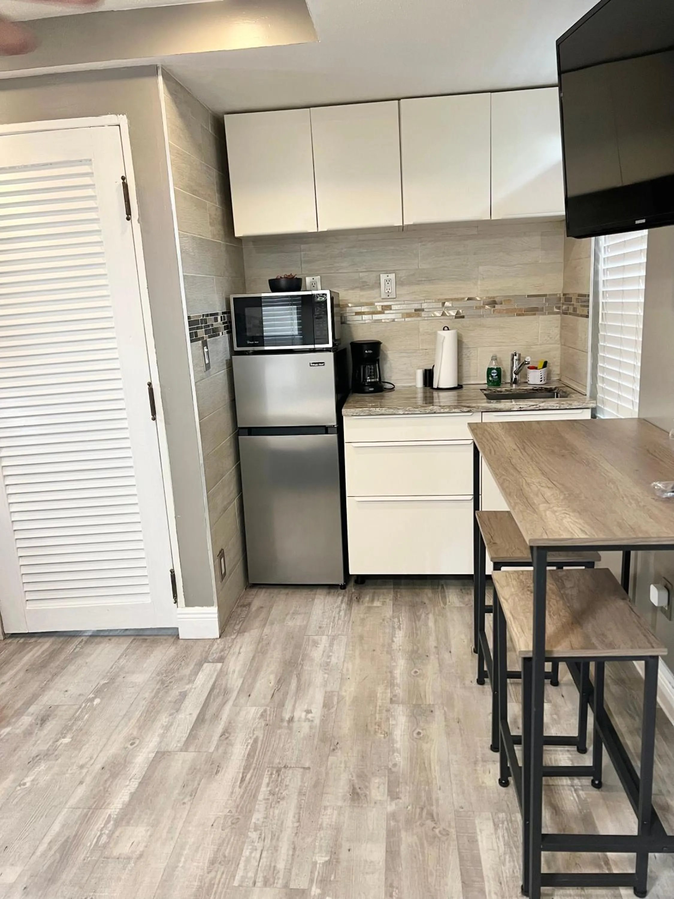 Kitchen or kitchenette in Harmonious Suites