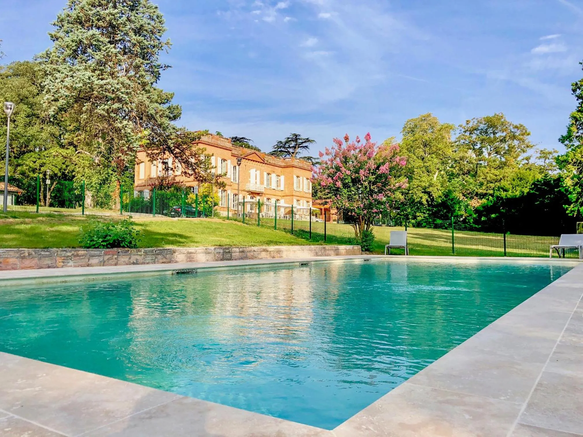 Garden view in Best Western Premier Le Domaine de Montjoie
