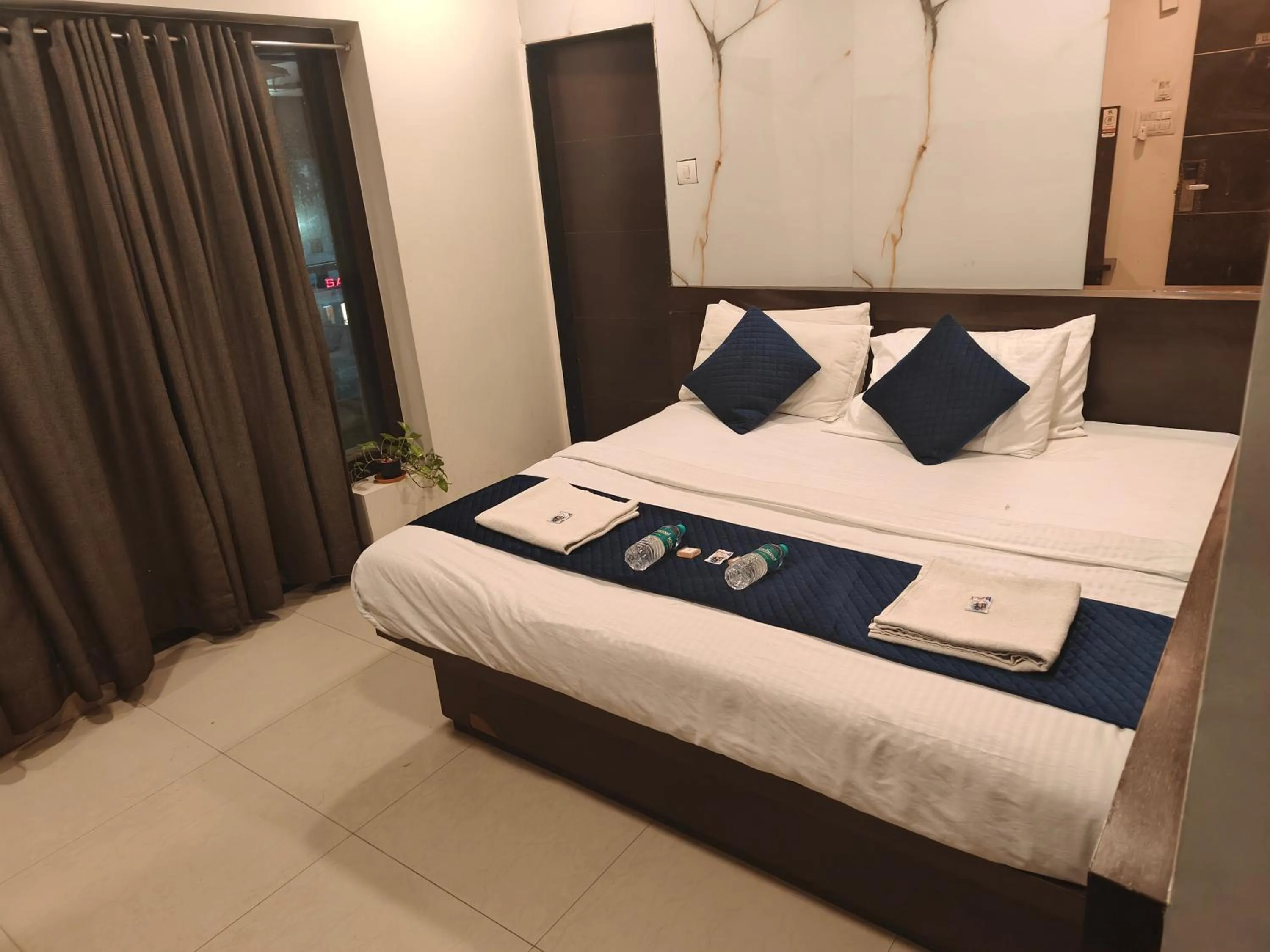 Bed in Hotel Anand Palace