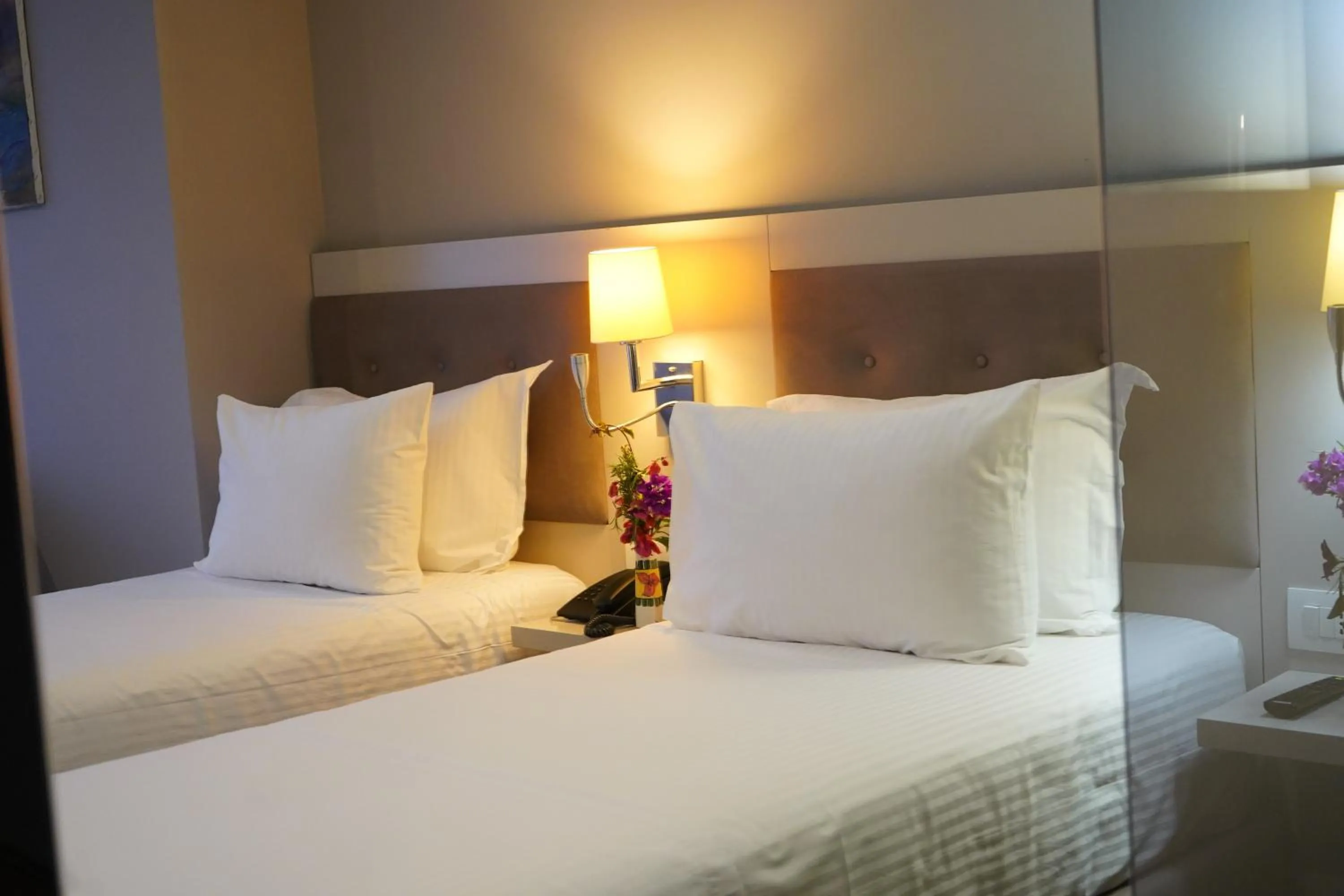 Bed in Bougainville Bay Hotel