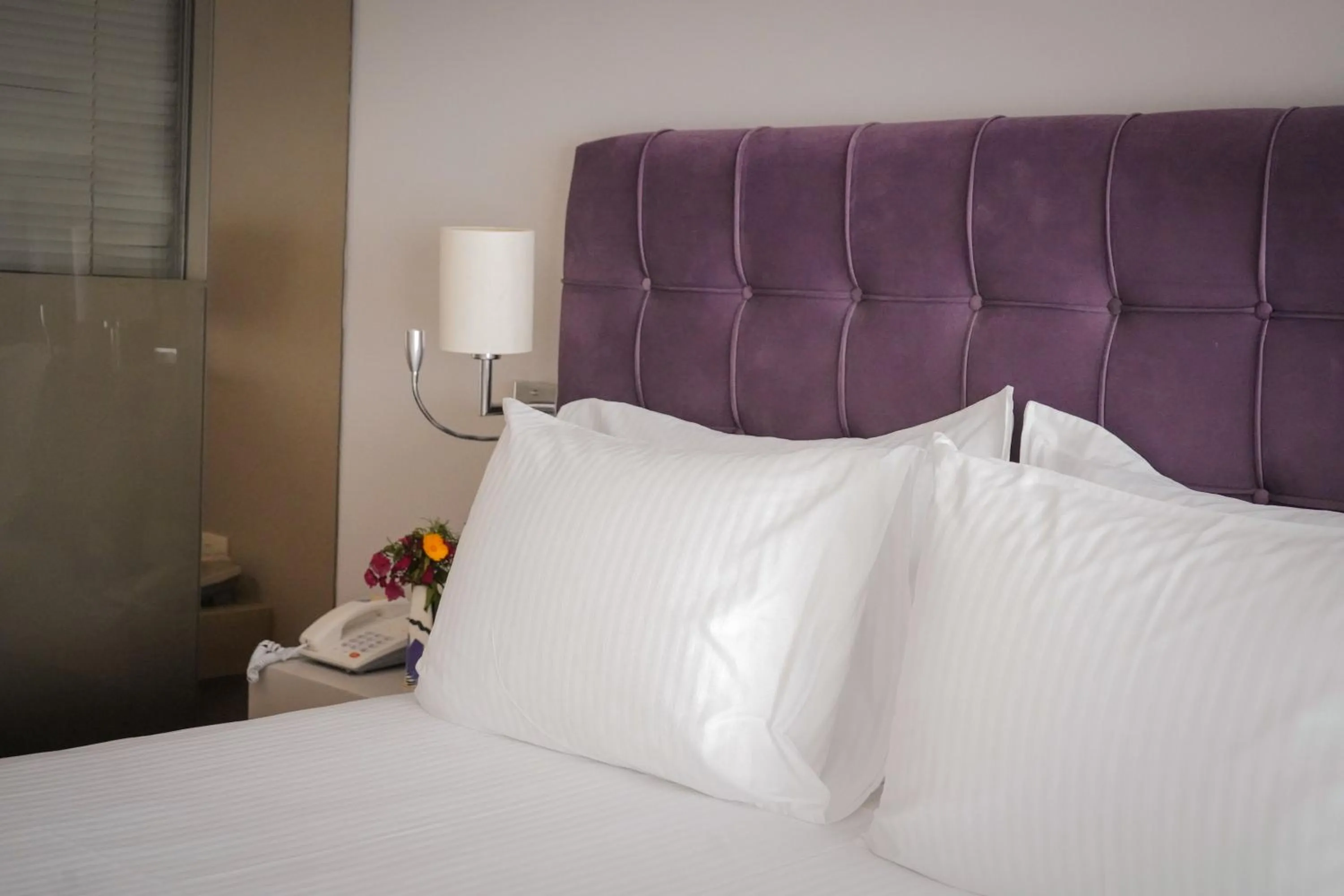 Bed in Bougainville Bay Hotel