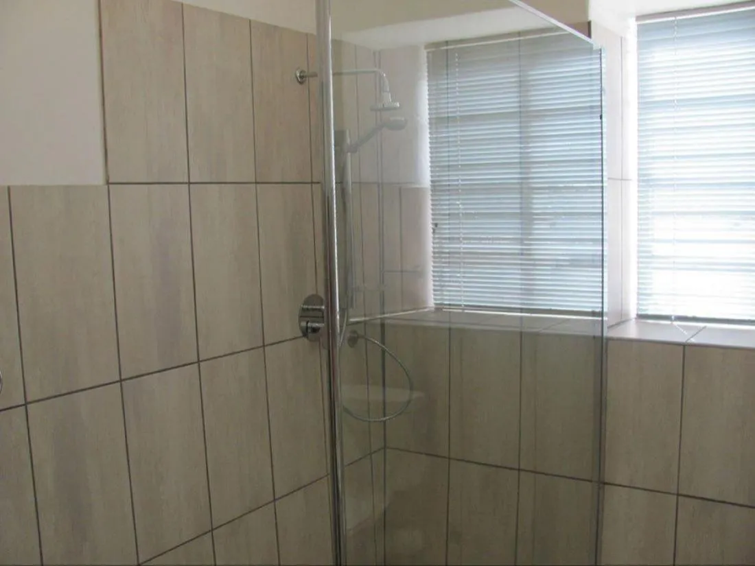 Shower in Stellar Dust Guesthouse Previously The Blue Moon Guesthouse