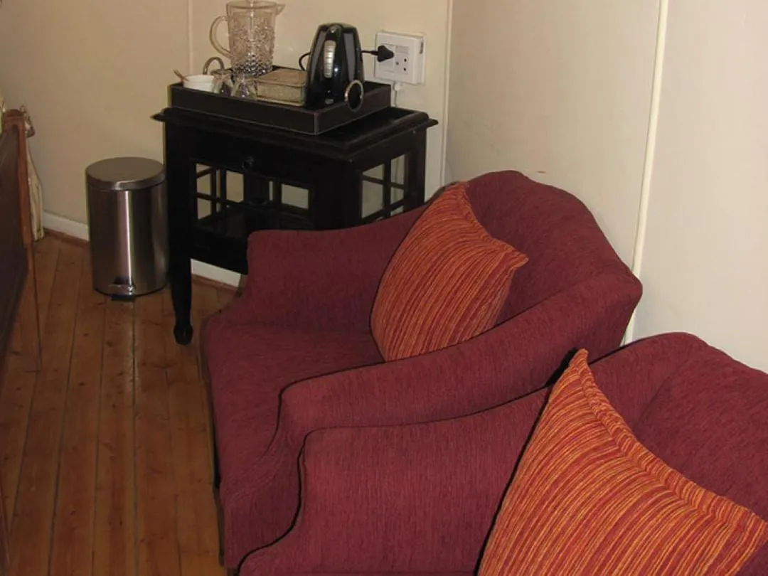 Seating area in Stellar Dust Guesthouse Previously The Blue Moon Guesthouse