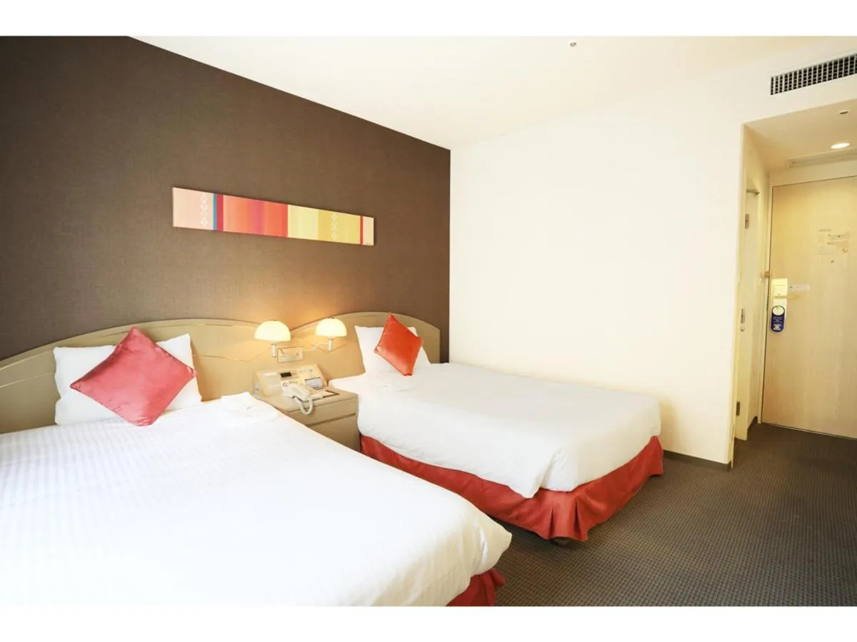 Photo of the whole room, Bed in Smile Hotel Naha City Resort