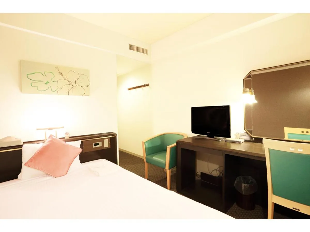 Photo of the whole room, Bed in Smile Hotel Naha City Resort