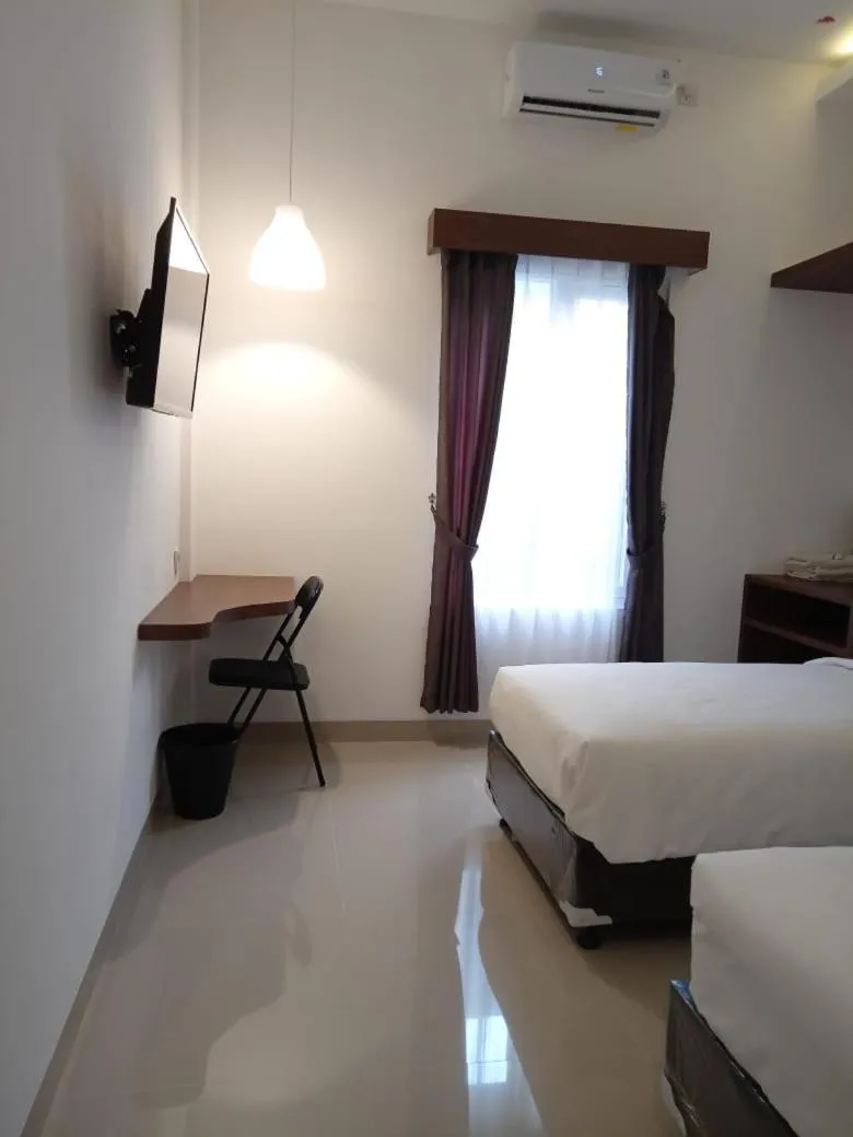 Bed in Alzara Hotel Syariah