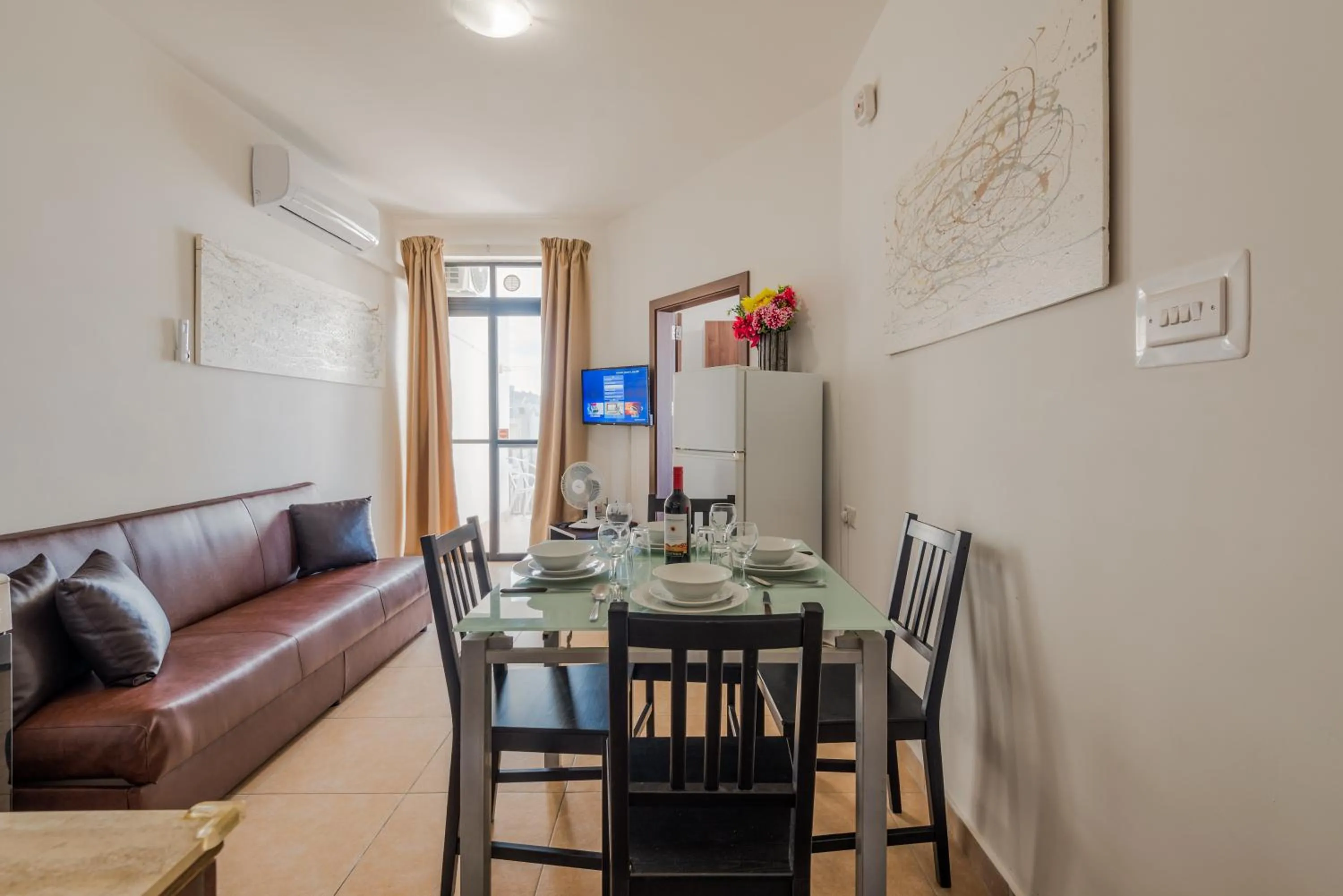 TV and multimedia in Seashells 2 bedroom Apartment with sunny terrace with stunning sea views - by Getawaysmalta