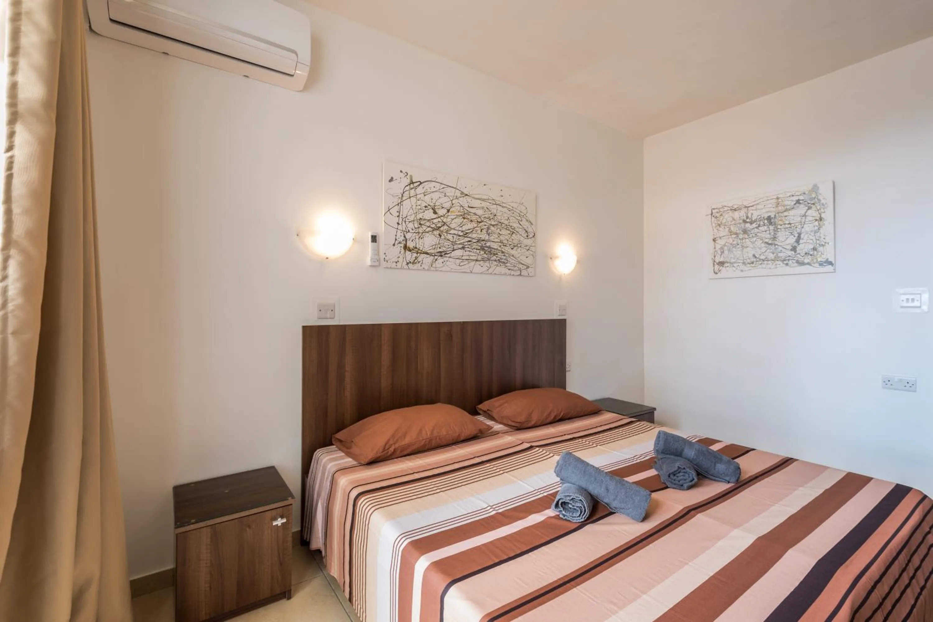 Bedroom, Bed in Seashells 2 bedroom Apartment with sunny terrace with stunning sea views - by Getawaysmalta