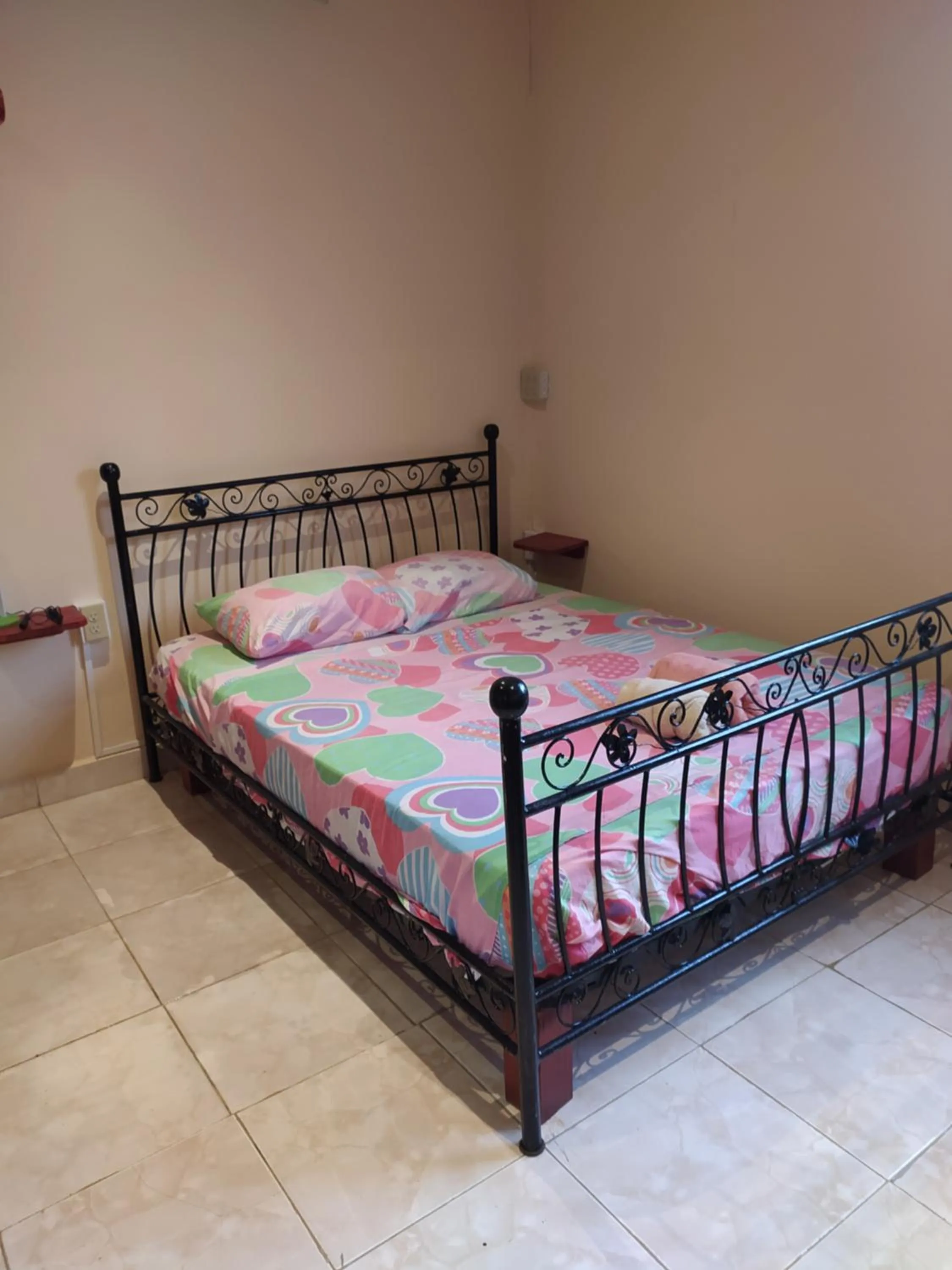 Bed in Sun Havens Apartments & Suites