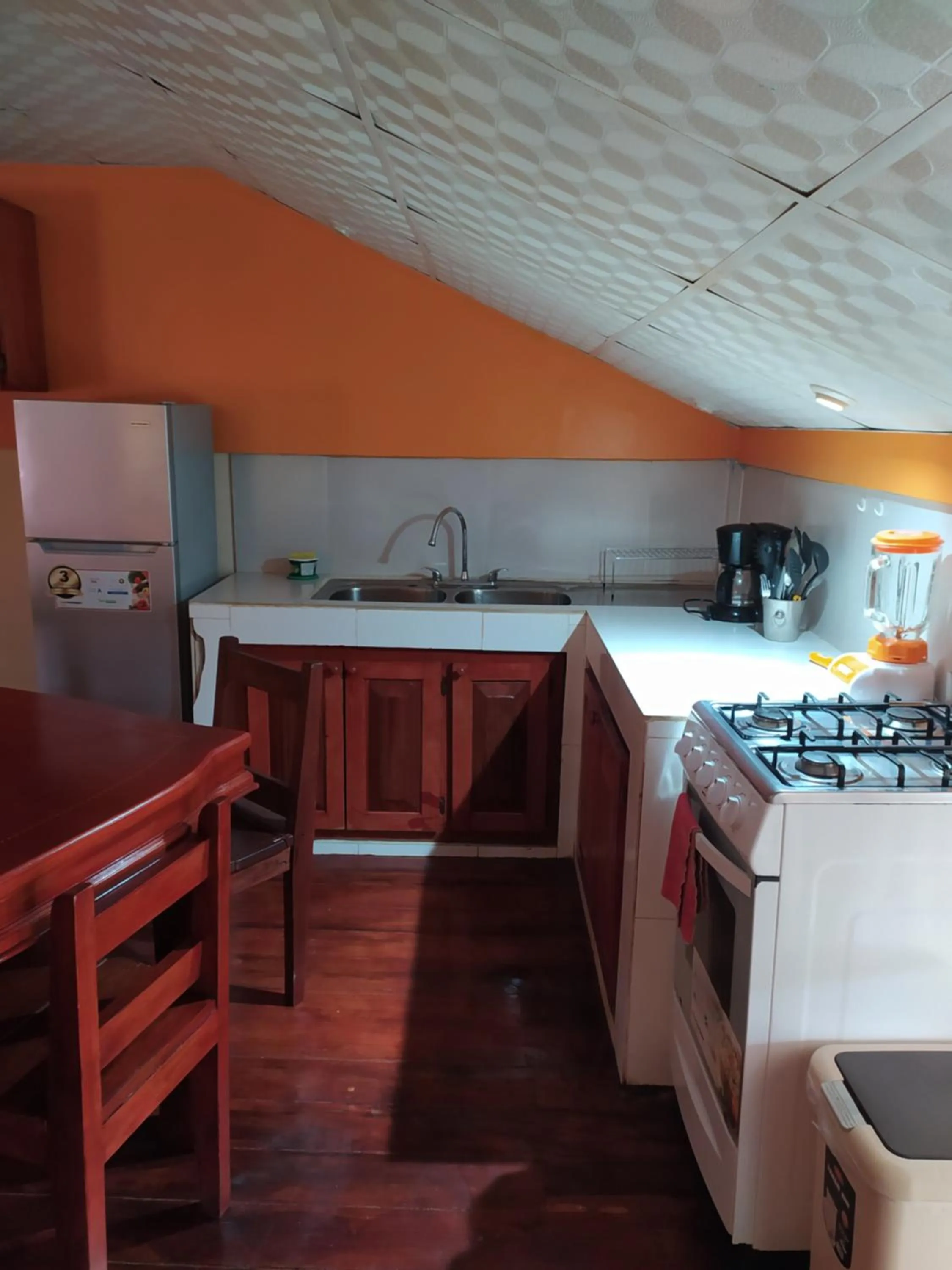 Kitchen or kitchenette in Sun Havens Apartments & Suites