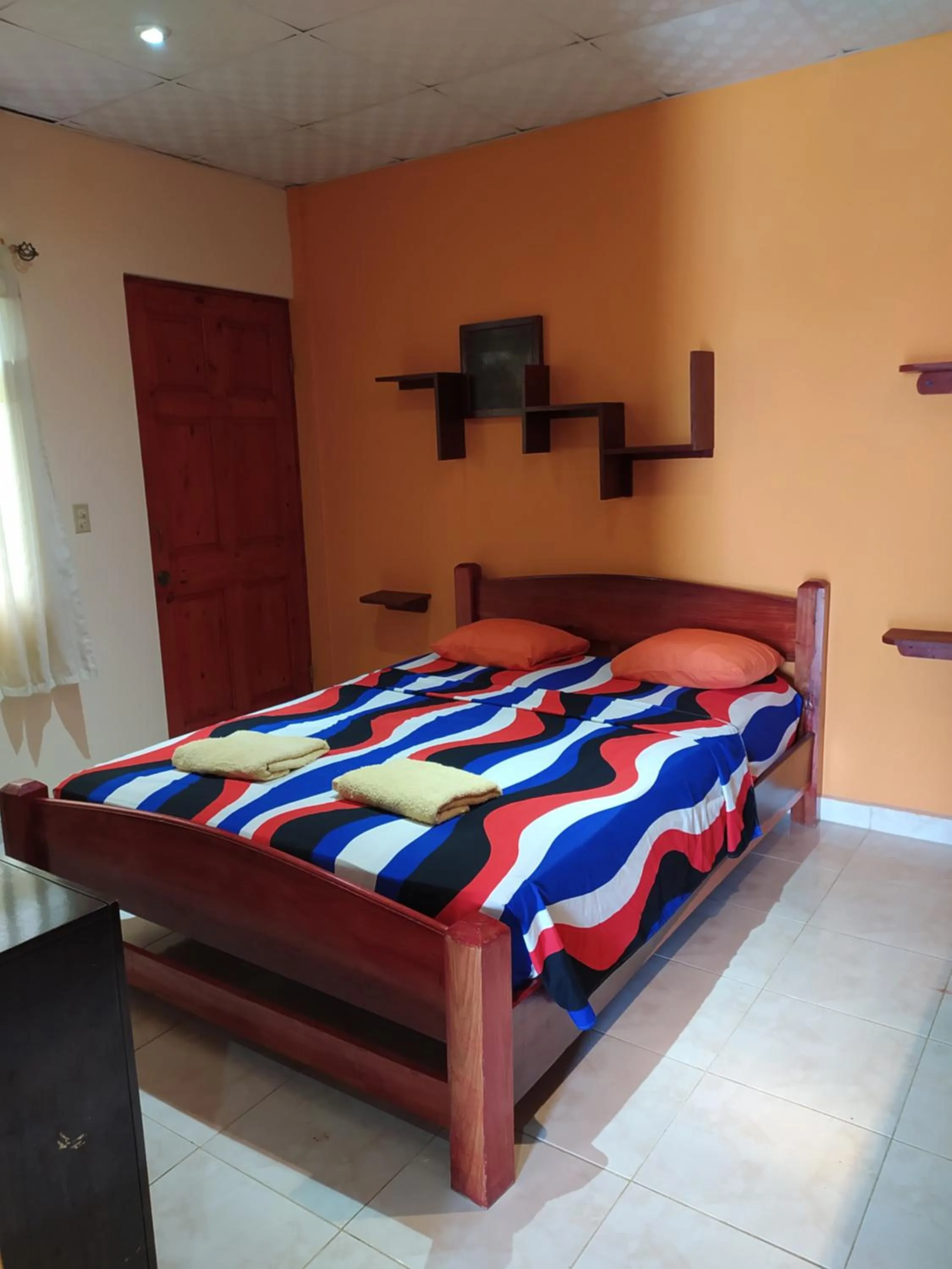 Bed in Sun Havens Apartments & Suites