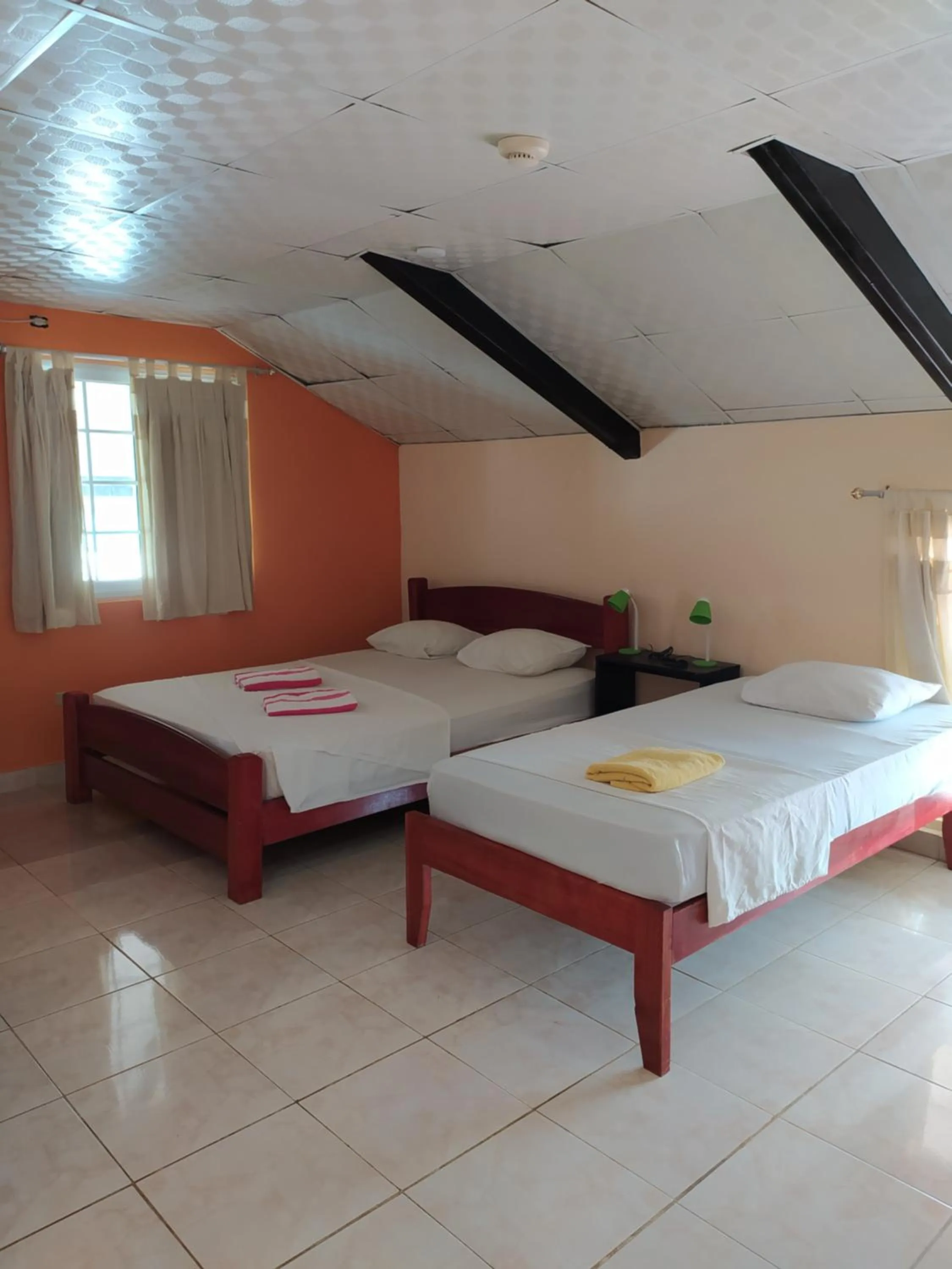 Bed in Sun Havens Apartments & Suites