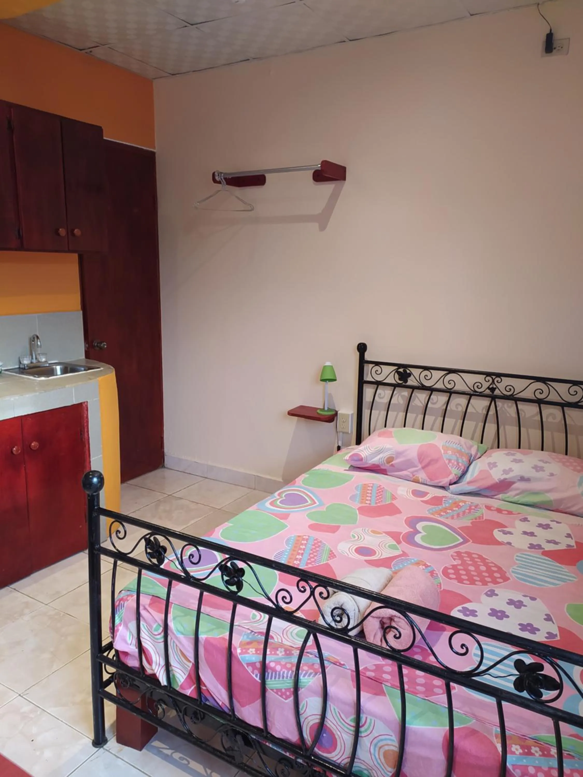 Bed in Sun Havens Apartments & Suites