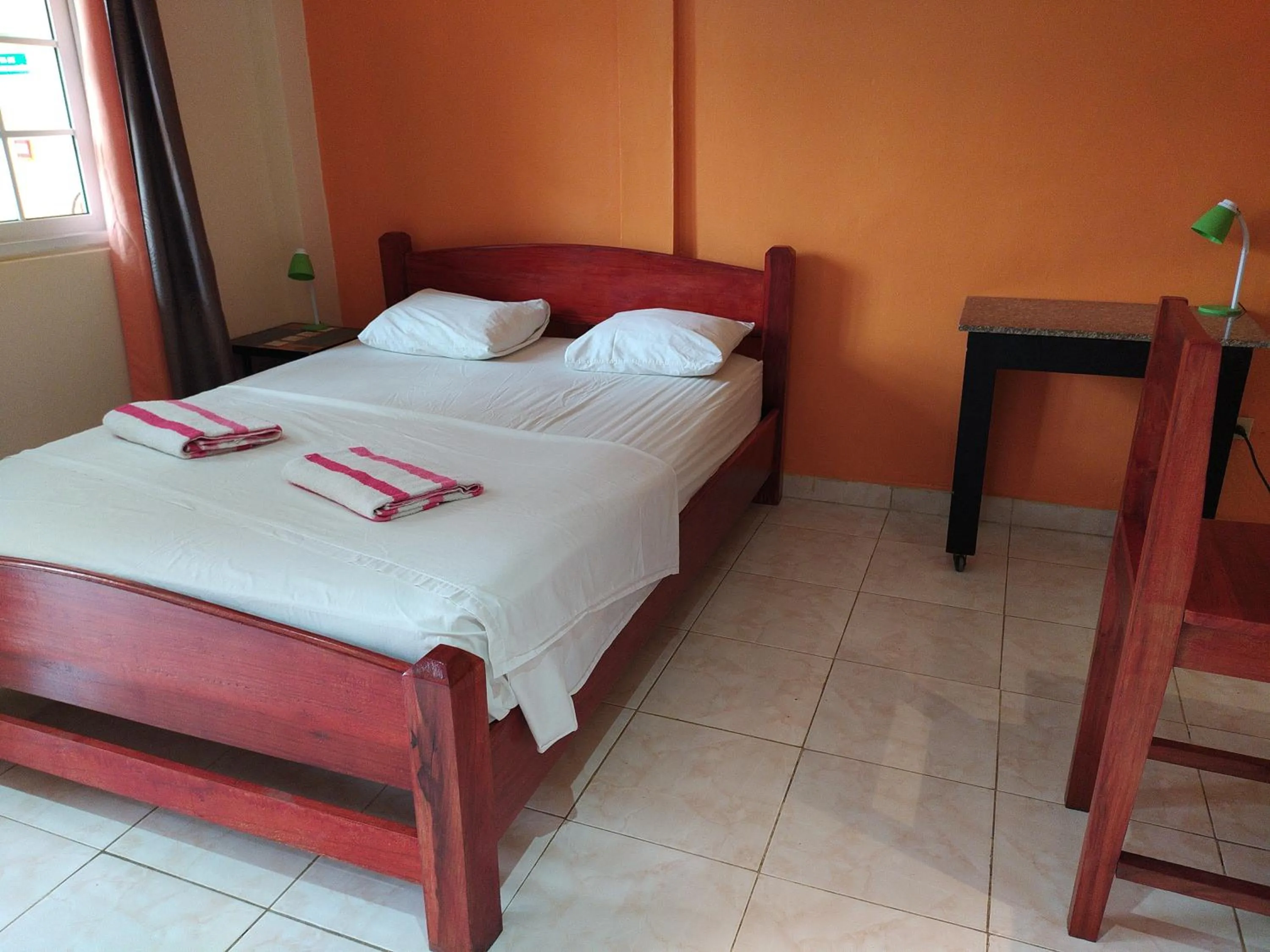 Bed in Sun Havens Apartments & Suites