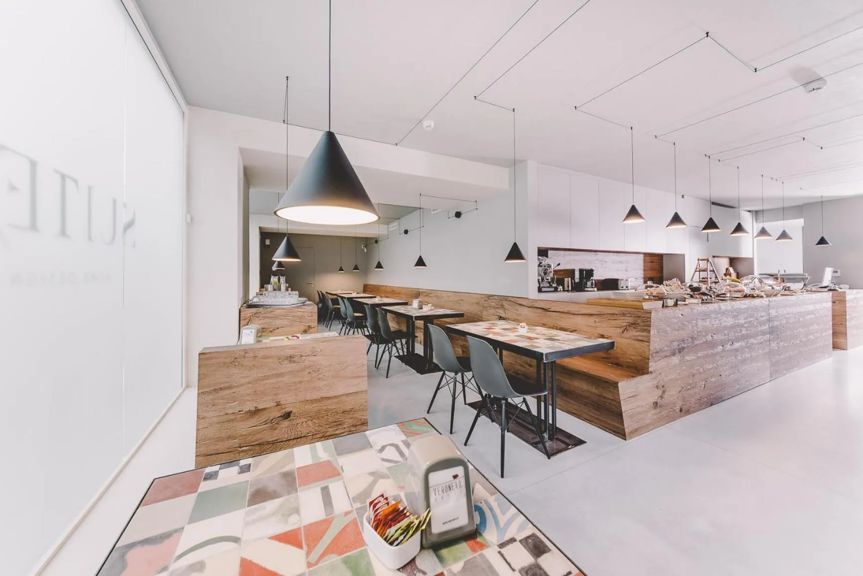 Communal lounge/ TV room in Suite 10 Home Design & Spa