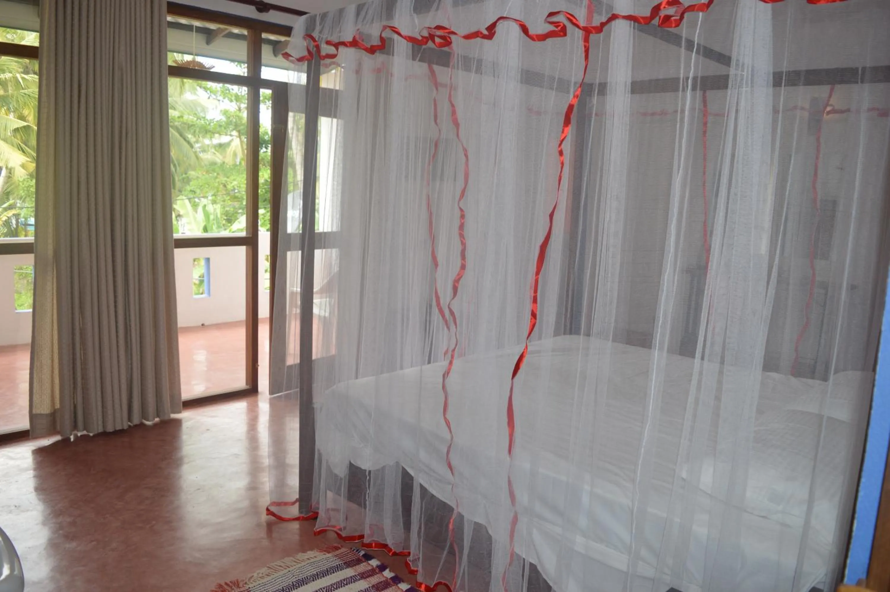 Bed in FEEL Beach Apartments