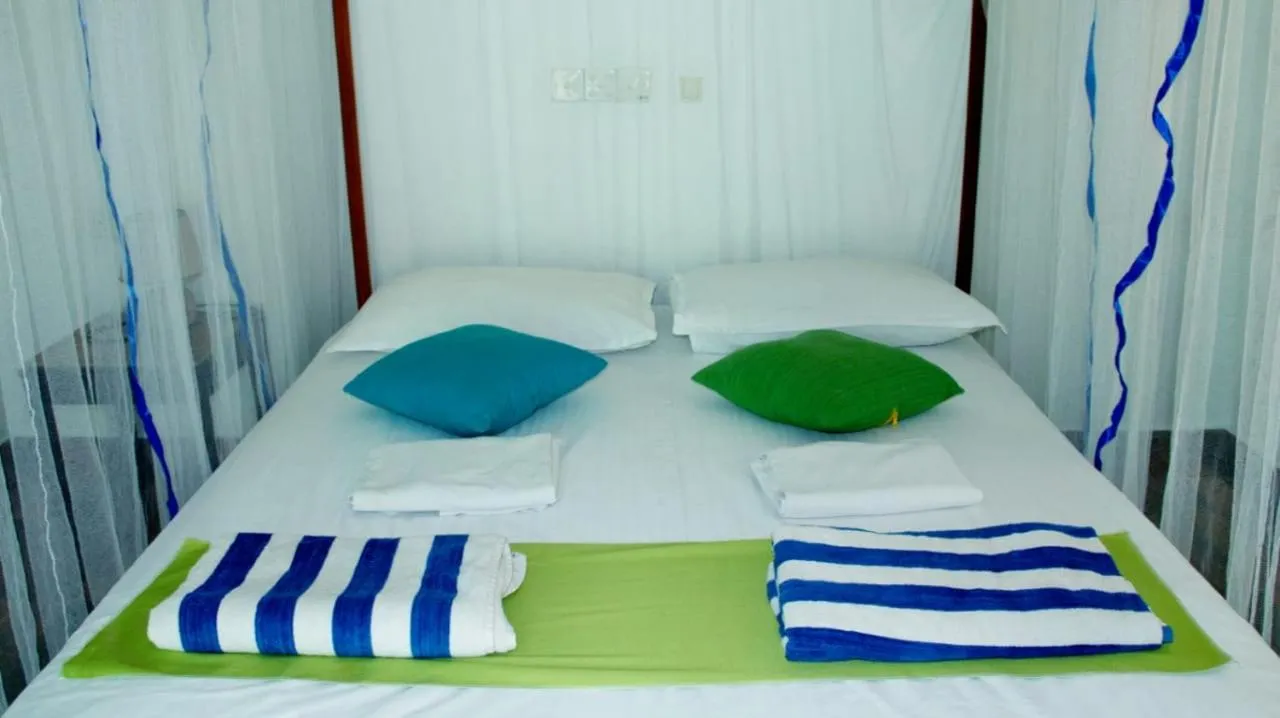 Bed in FEEL Beach Apartments