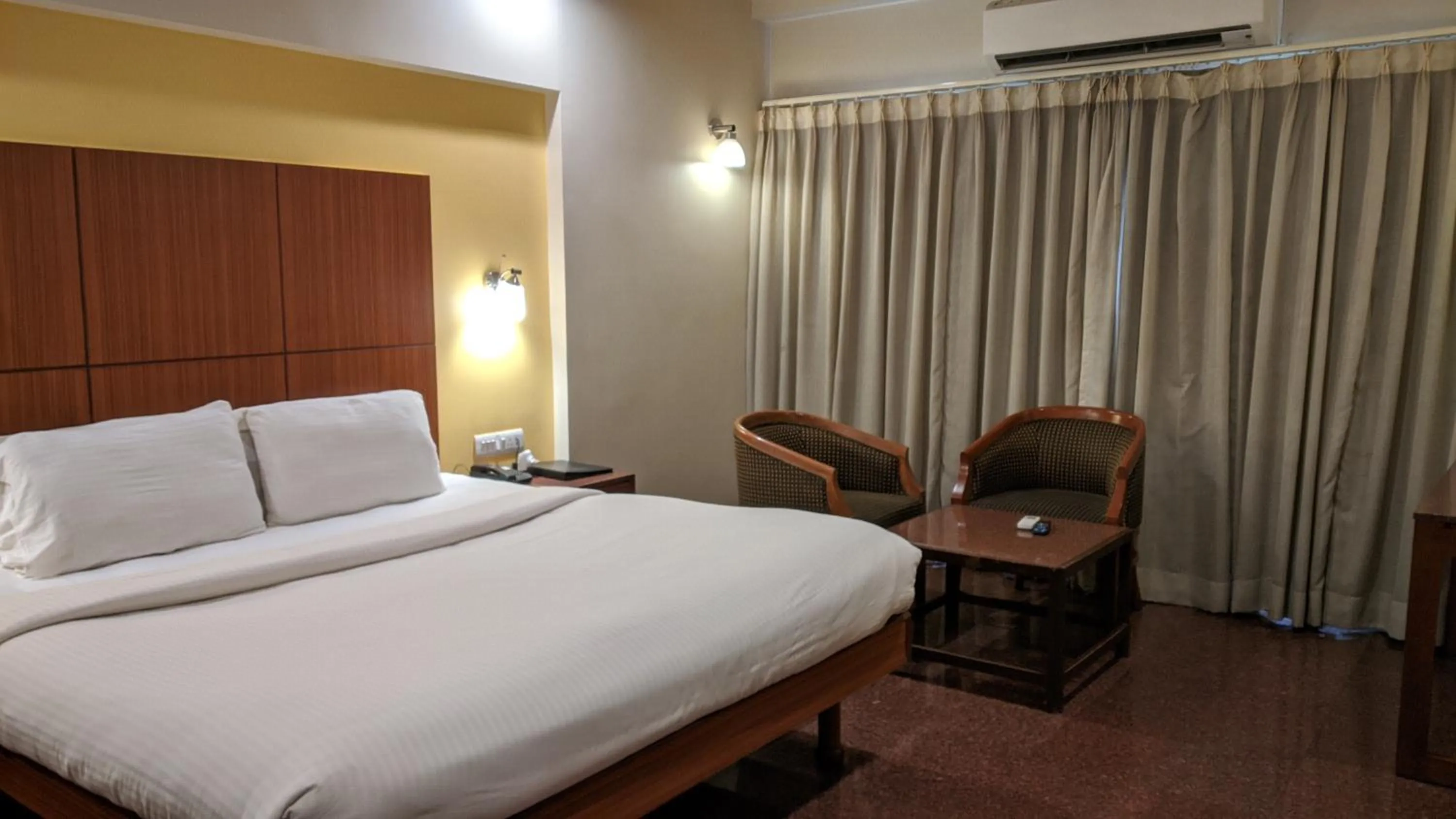 Bed in Hotel Sankam Residency