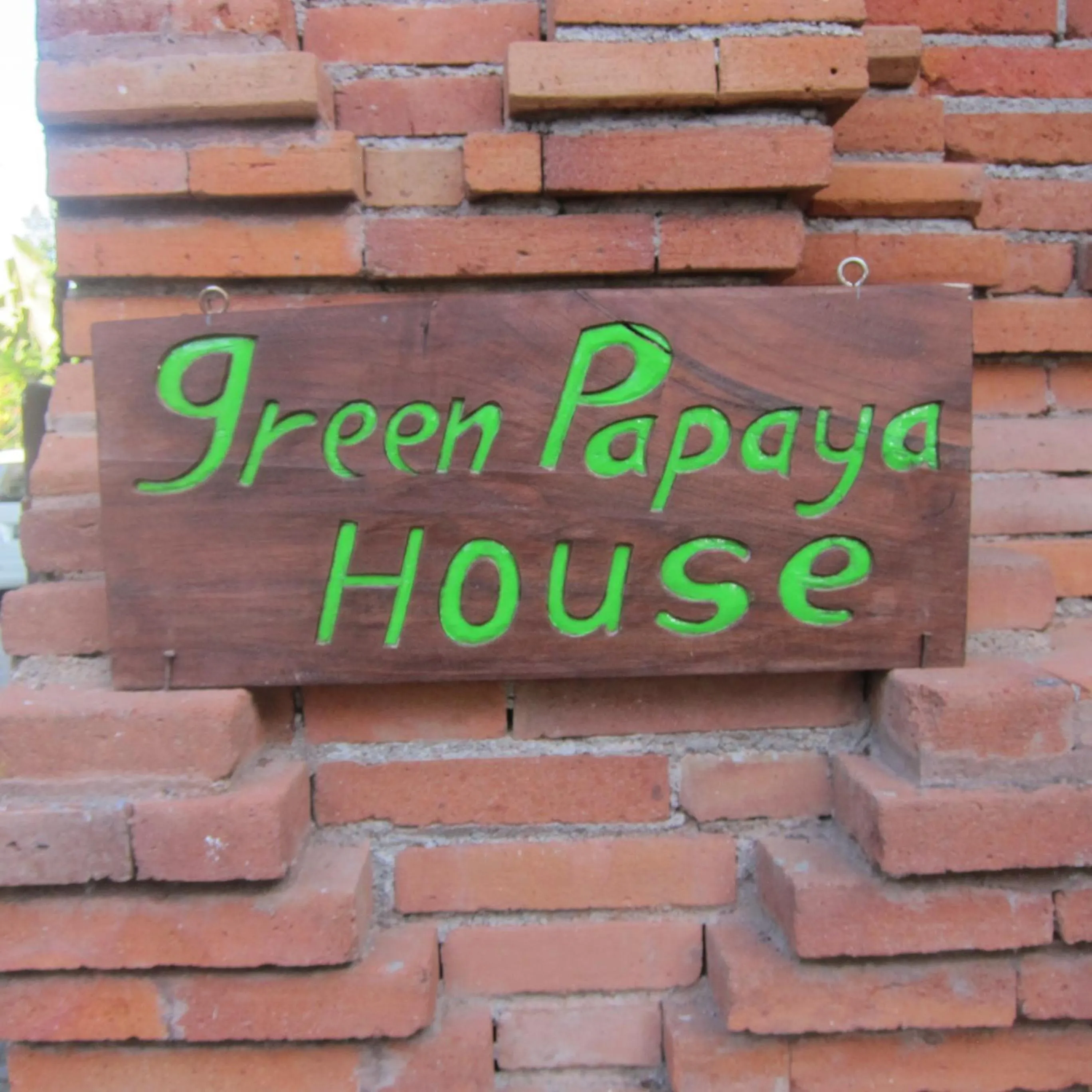 Property logo or sign in Green Papaya House