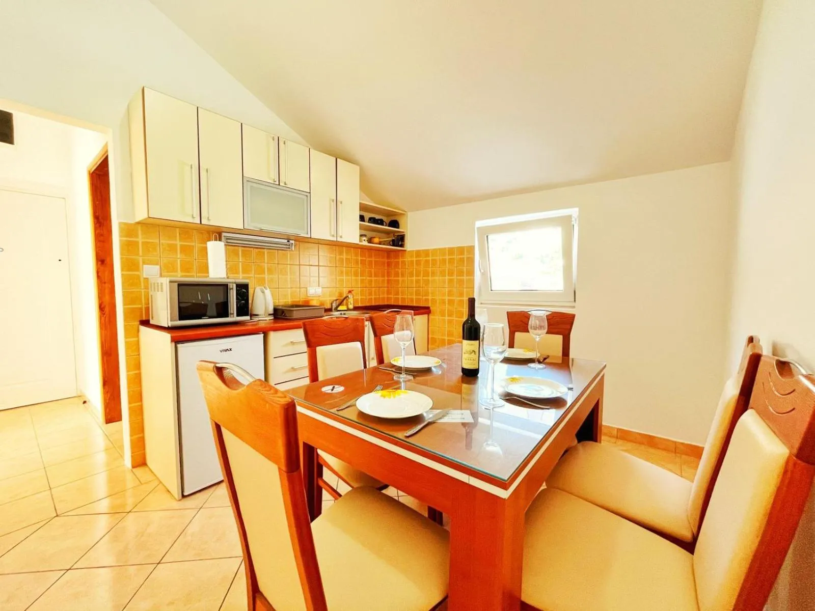 Kitchen or kitchenette in Apartments Dosljak