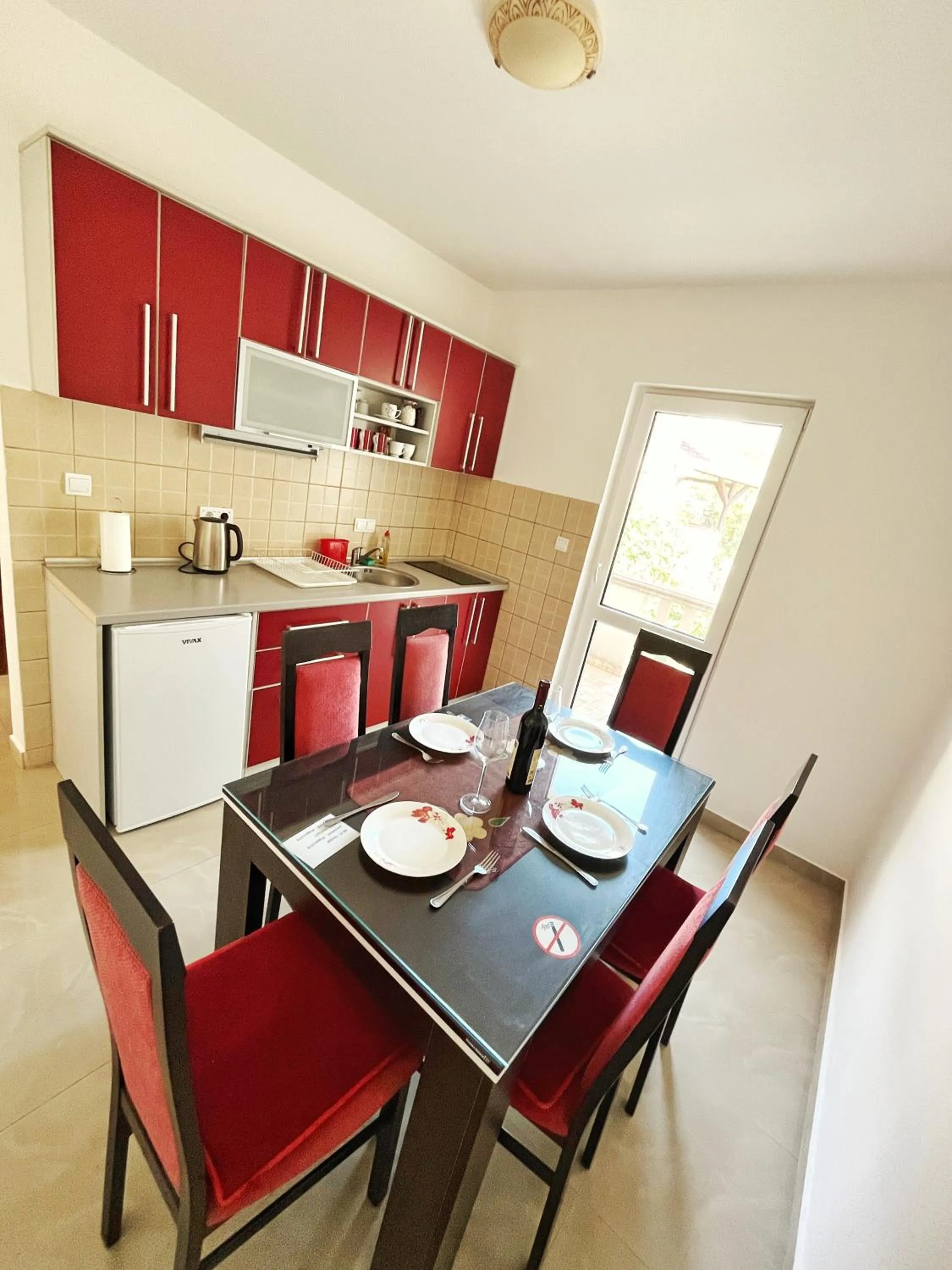 Kitchen or kitchenette in Apartments Dosljak