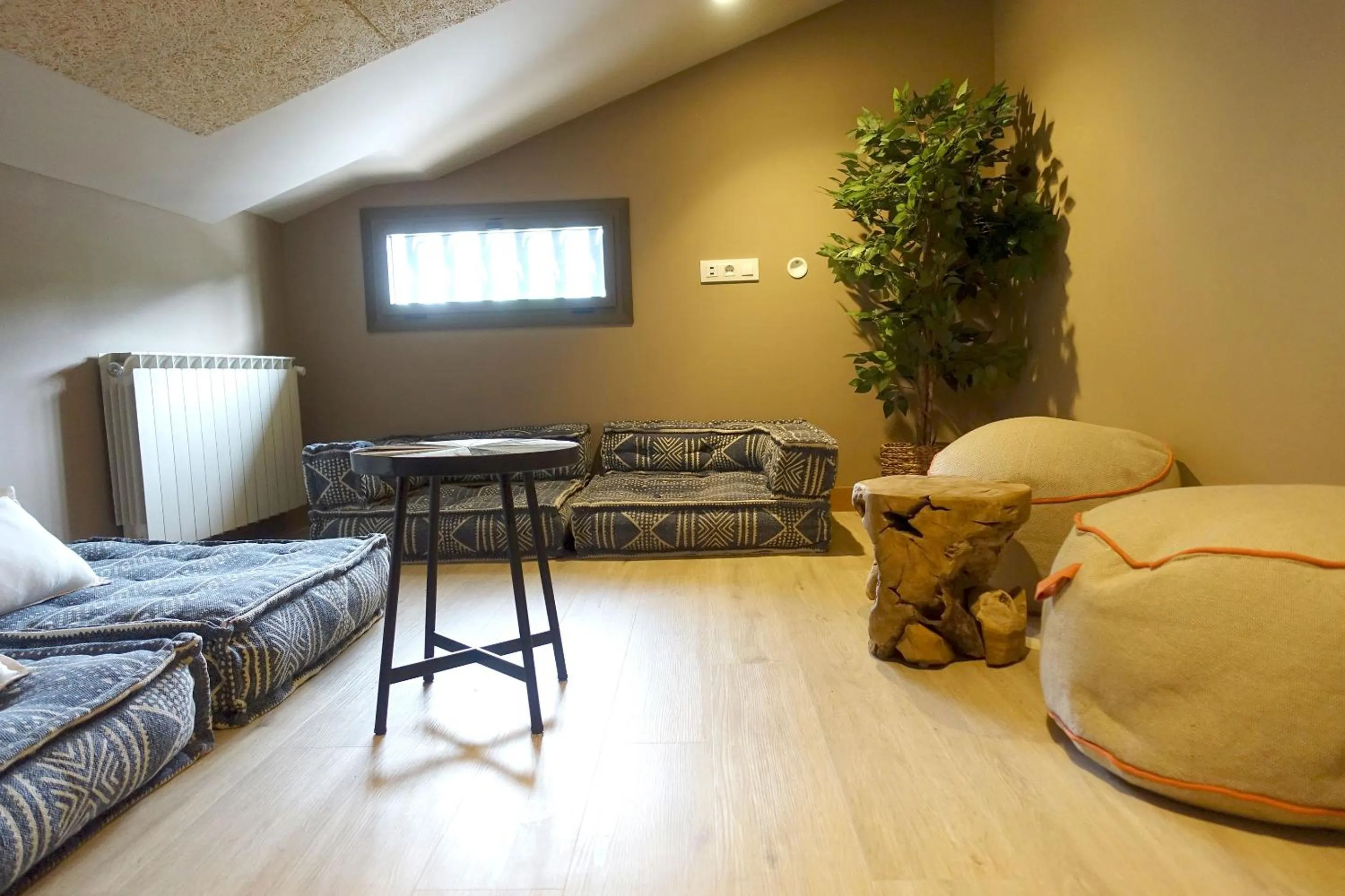 Communal lounge/ TV room in Font Andorra Hostel by Nexta