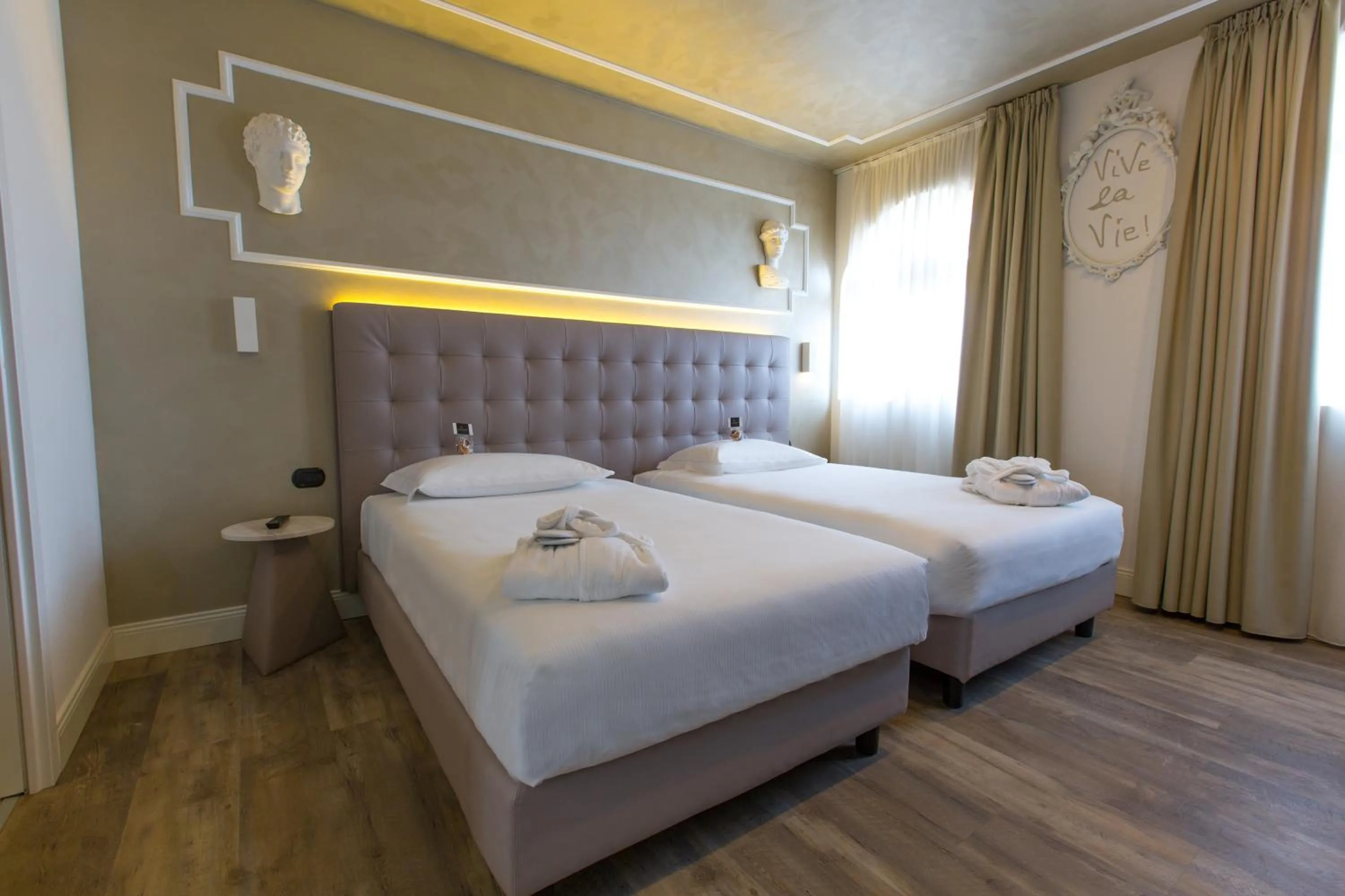 Bed in Hotel Al Campanile - Luxury Suites & Apartments
