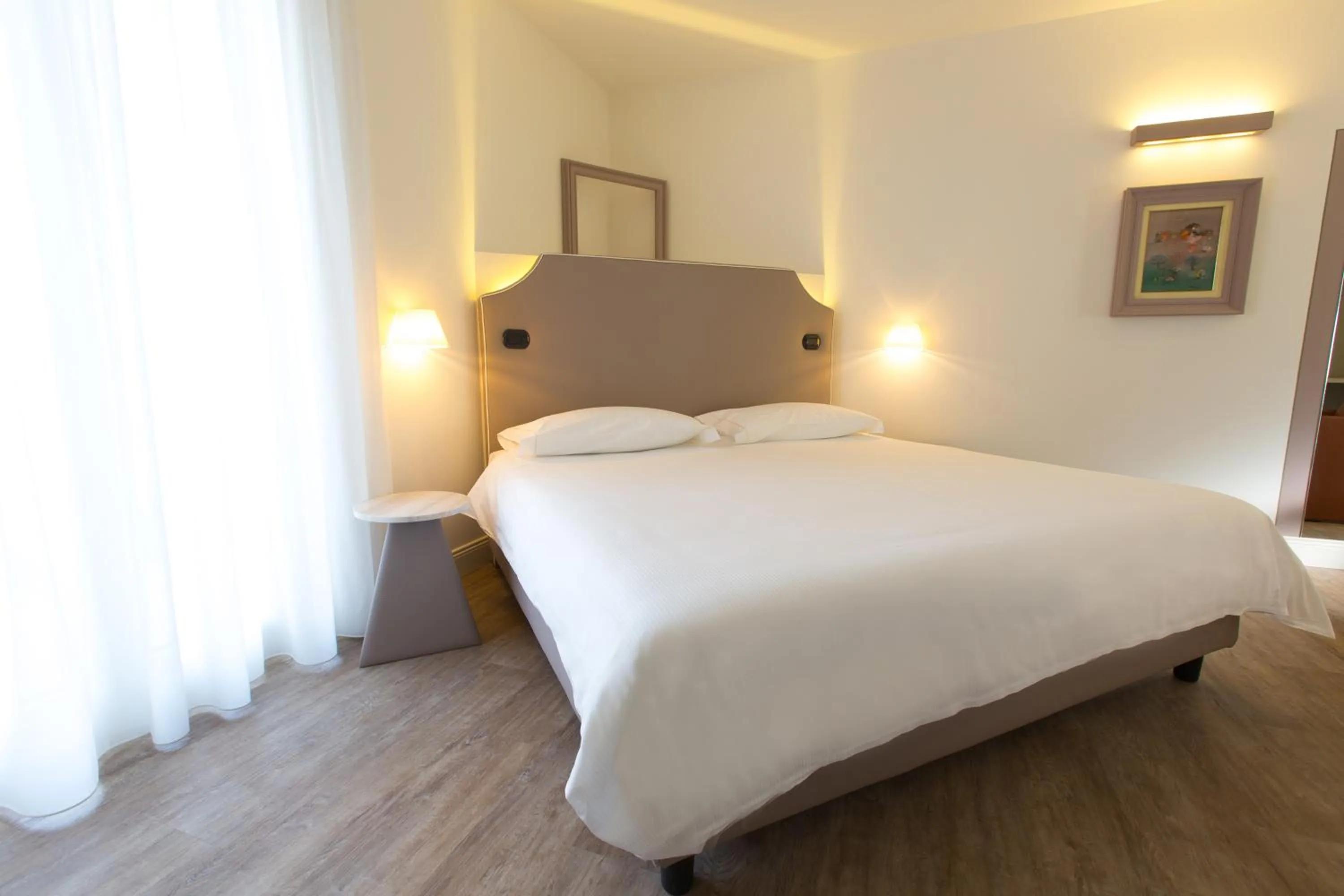 Bed in Hotel Al Campanile - Luxury Suites & Apartments